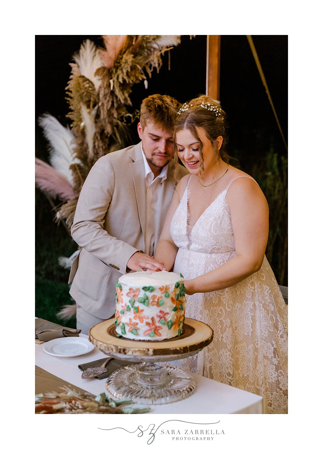 bride and groom cut cake at Rhode Island wedding reception