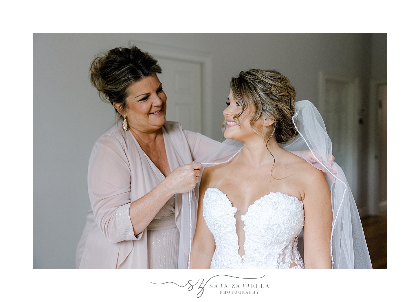 bride and mother smile together preparing for Westerly RI wedding day