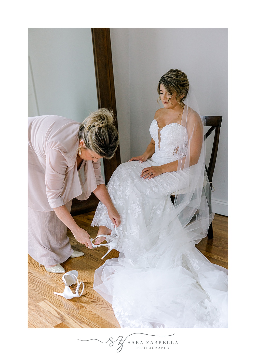 mother helps bride with shoes before Westerly RI wedding day