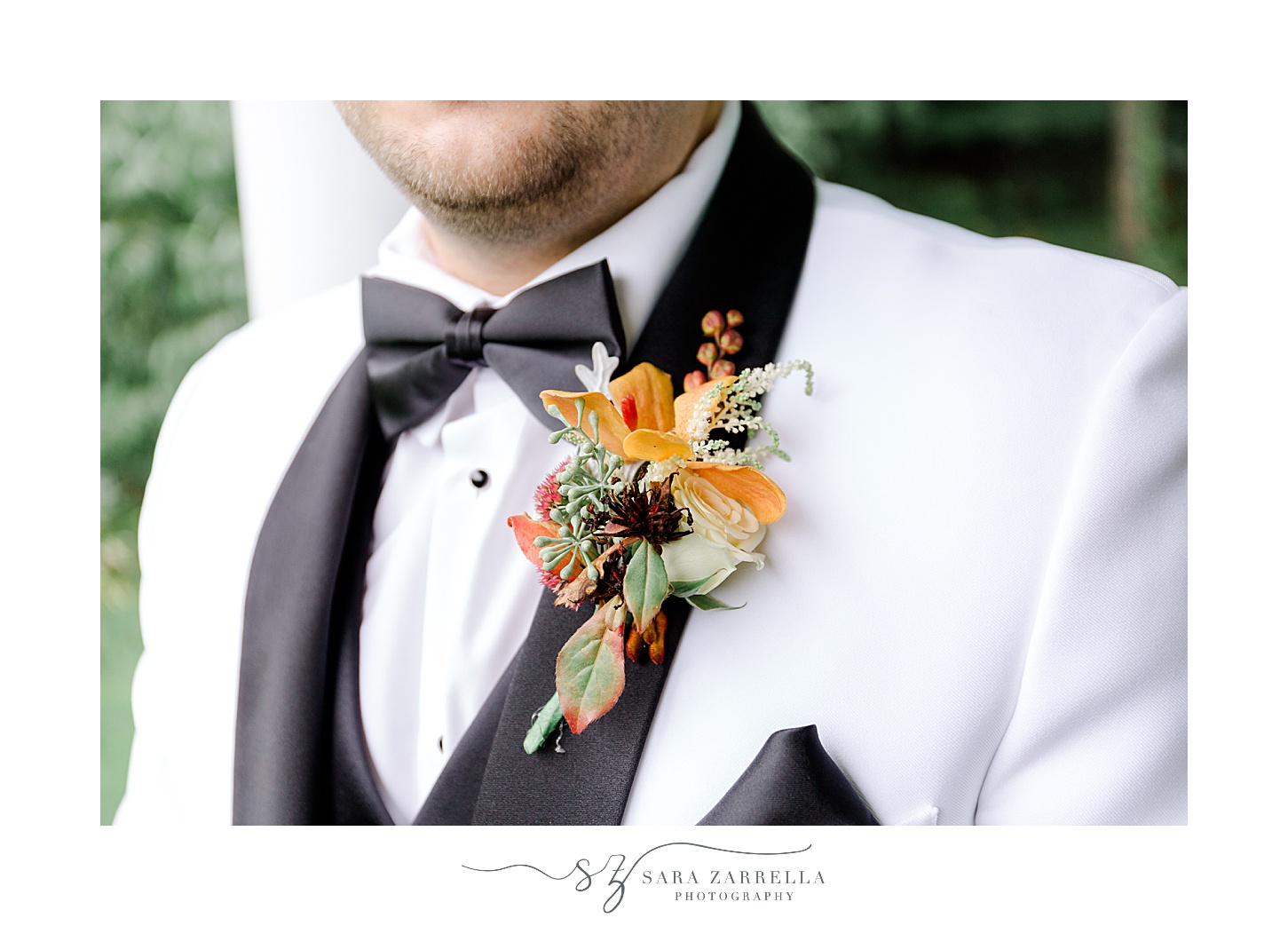 groom's fall floral boutonnière with yellow and orange flowers 