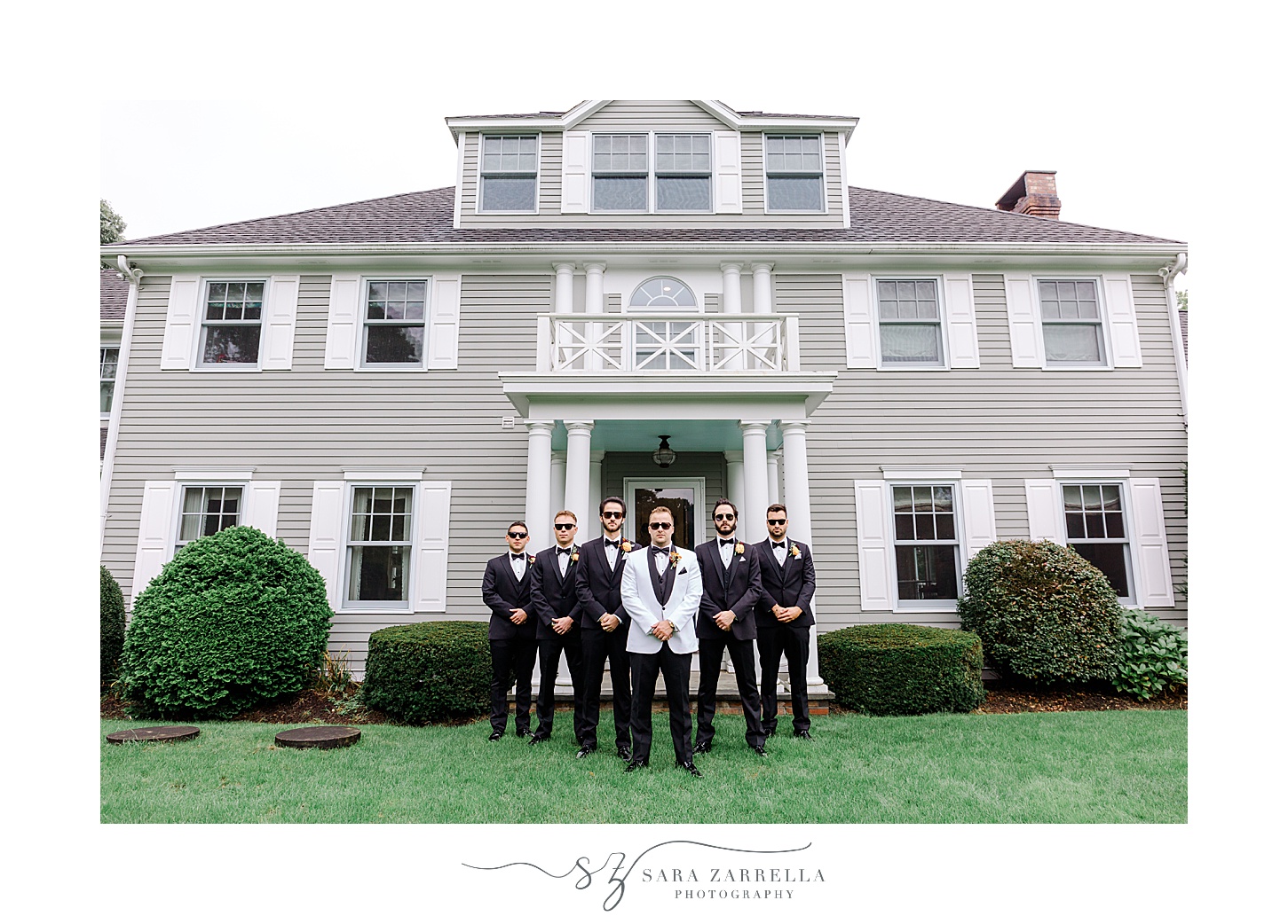 groom stand with groomsmen on lawn of Westerly RI home
