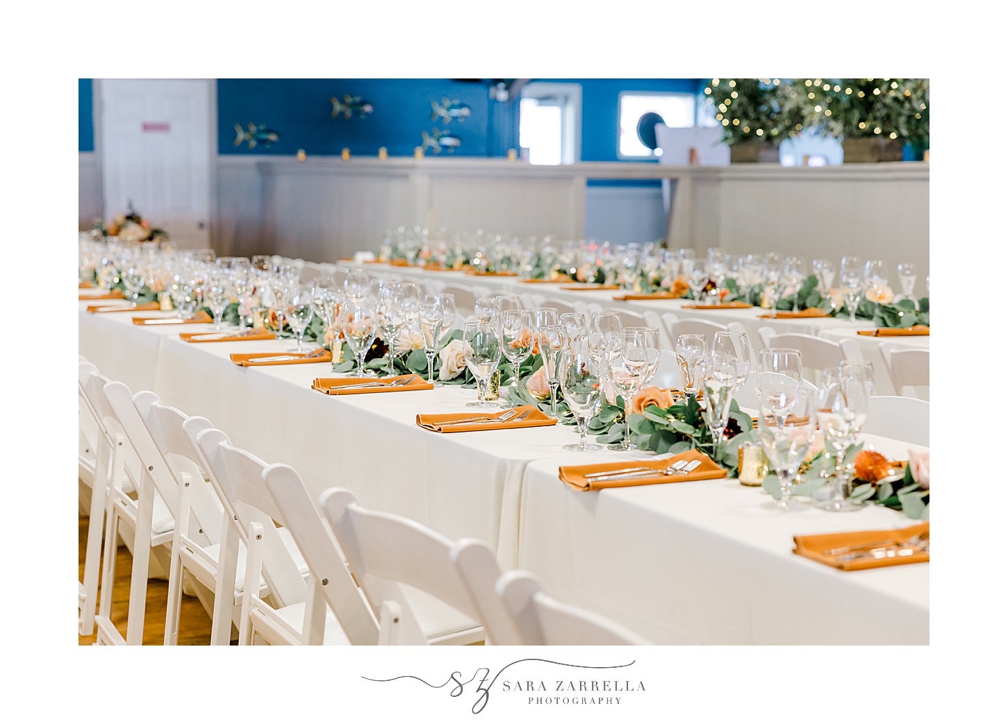 wedding reception at the Windjammer with orange napkins and fall florals 