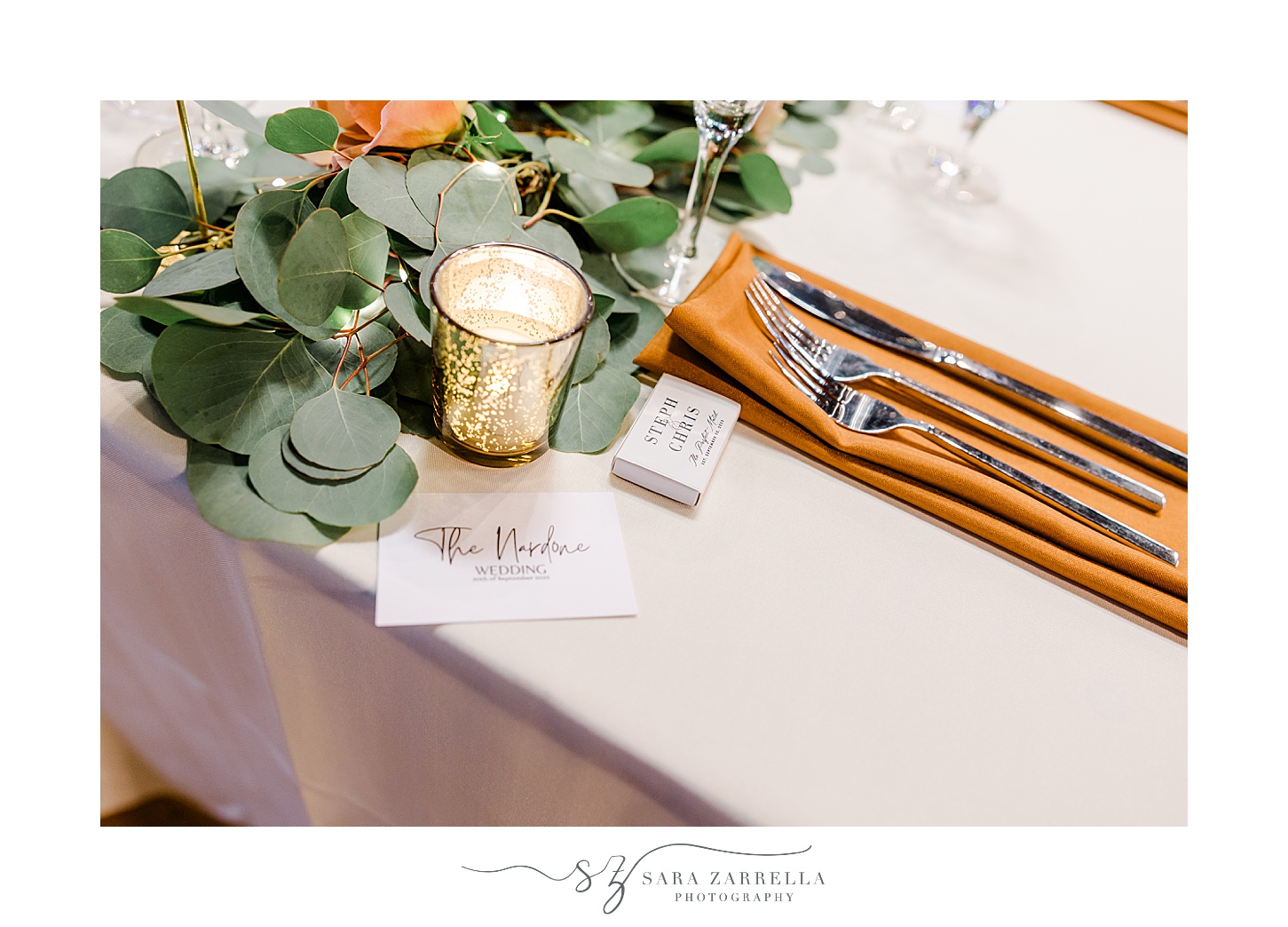 wedding reception with greenery draped down table at the Windjammer