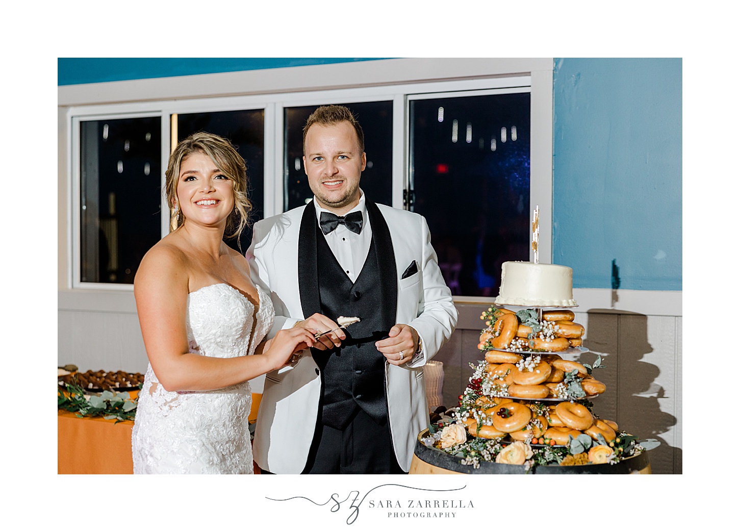 bride and groom cut wedding cake at the Windjammer