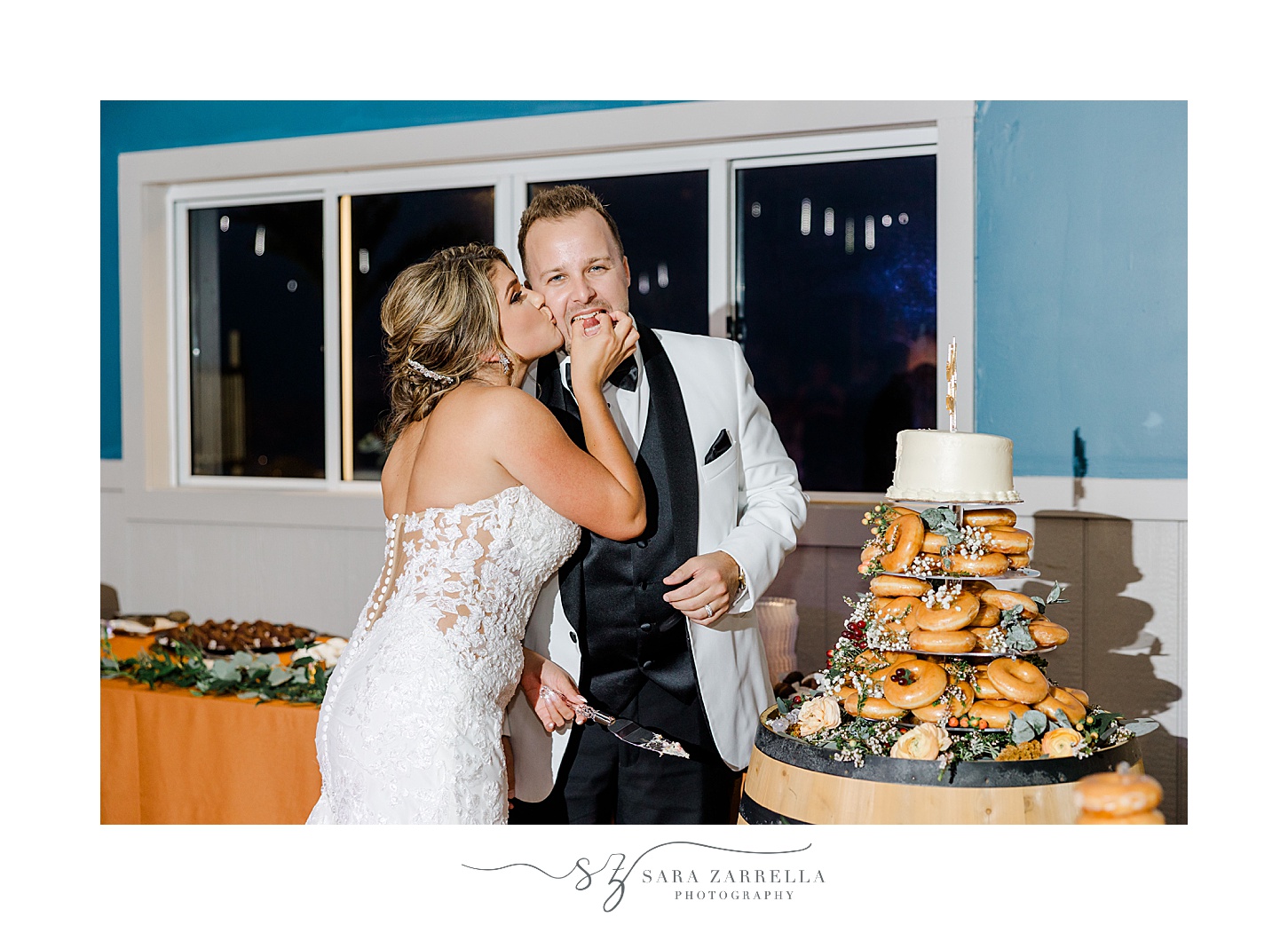 bride and groom cut wedding cake at the Windjammer