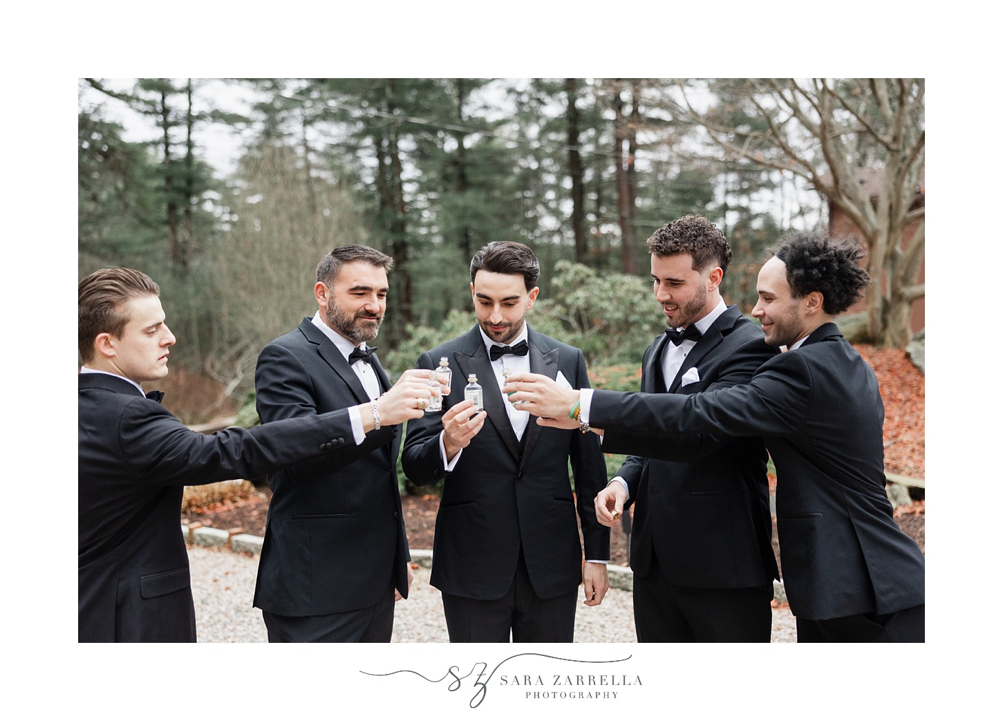 groomsmen drink shots together outside RI home