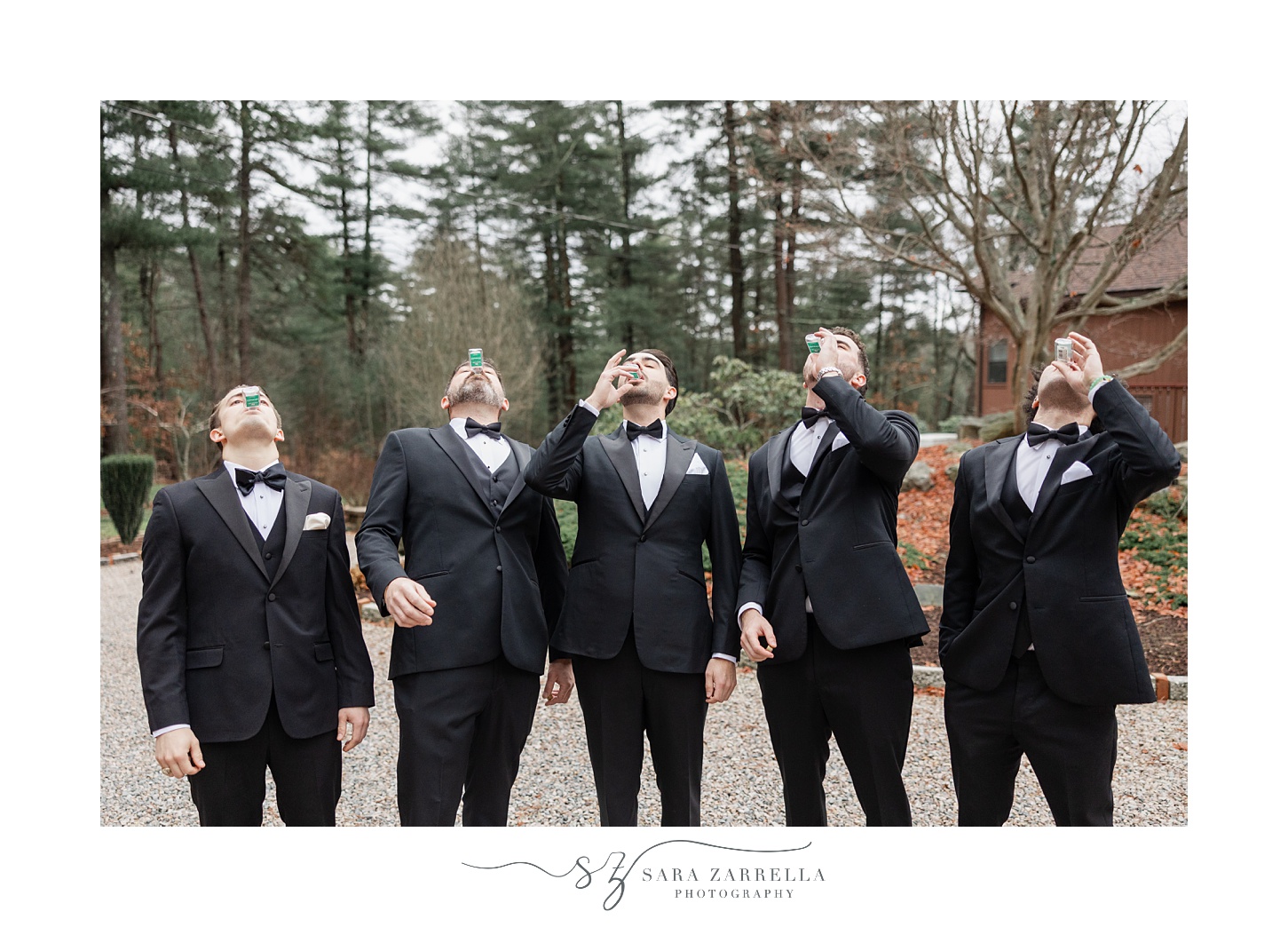 groomsmen toss back drinks outside Rhode Island home