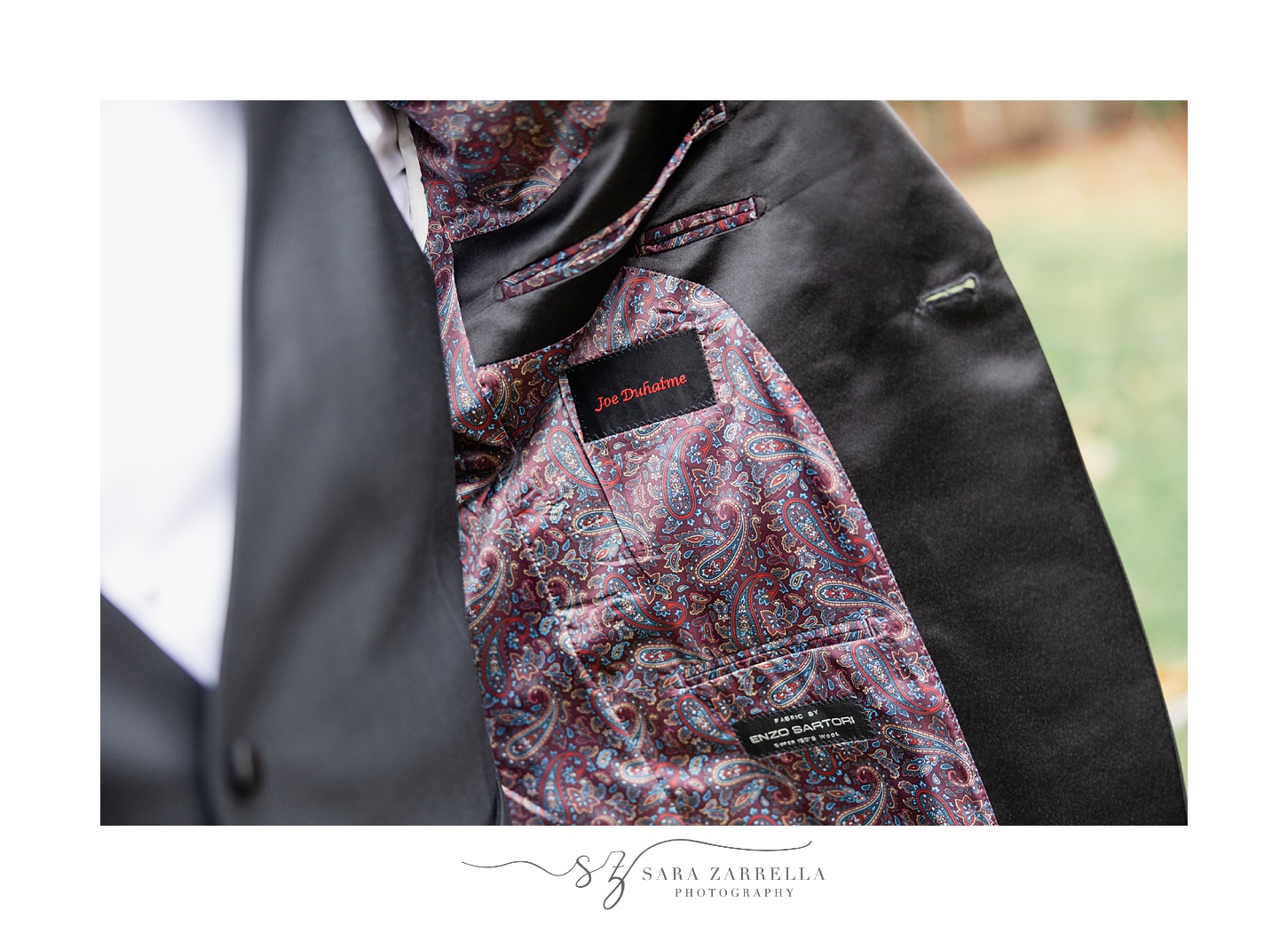 custom purple paisley lining of groom's suit 