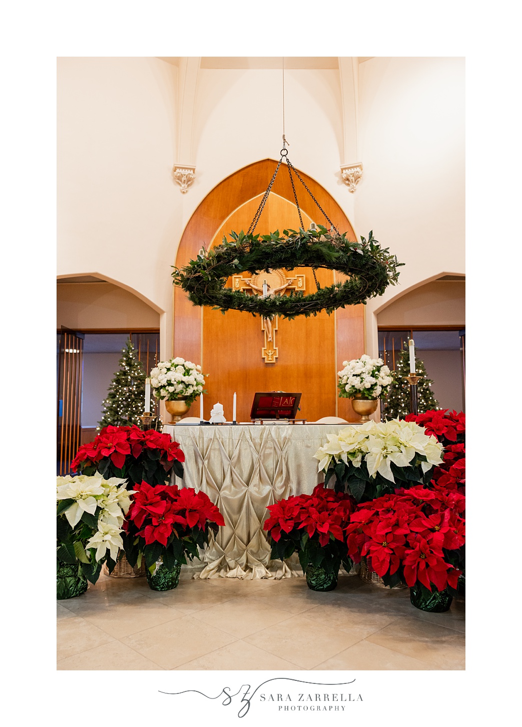 Christmas display with white and red poinsettias at St. Thomas Church in Providence RI