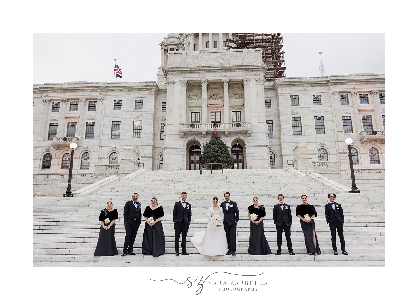 newlyweds stand in a line on the bottom step of the RI State House