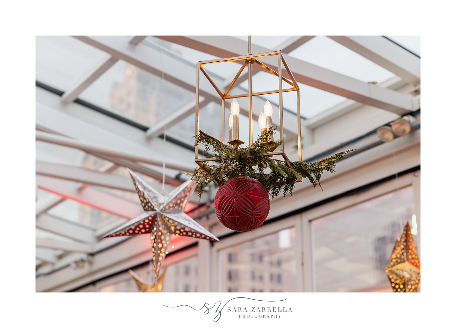 gold stairs and candles hang from glass ceiling at the Providence G