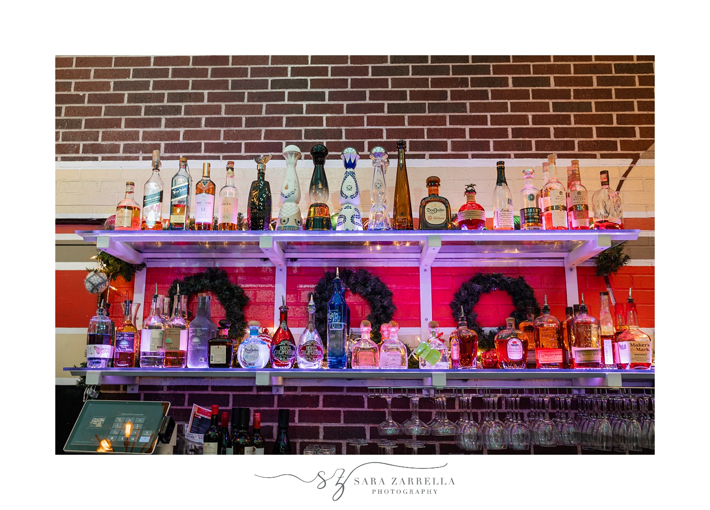 bar made of glass shelves with purple lighting at the Providence G