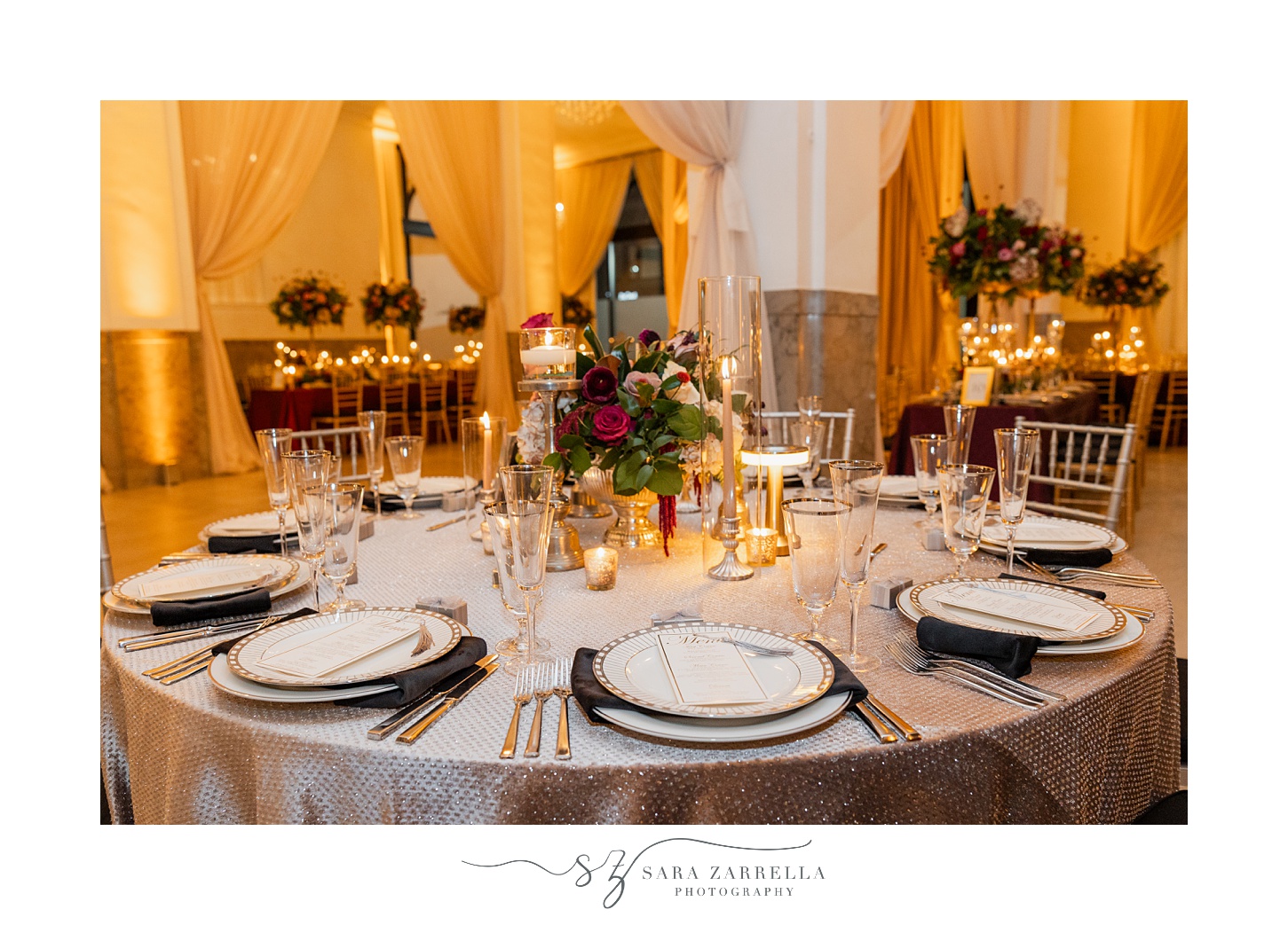 wedding reception place settings with gold and white plates 