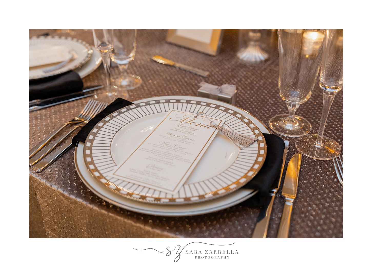 gold rimmed white plate with menu card at ballroom at the Providence G