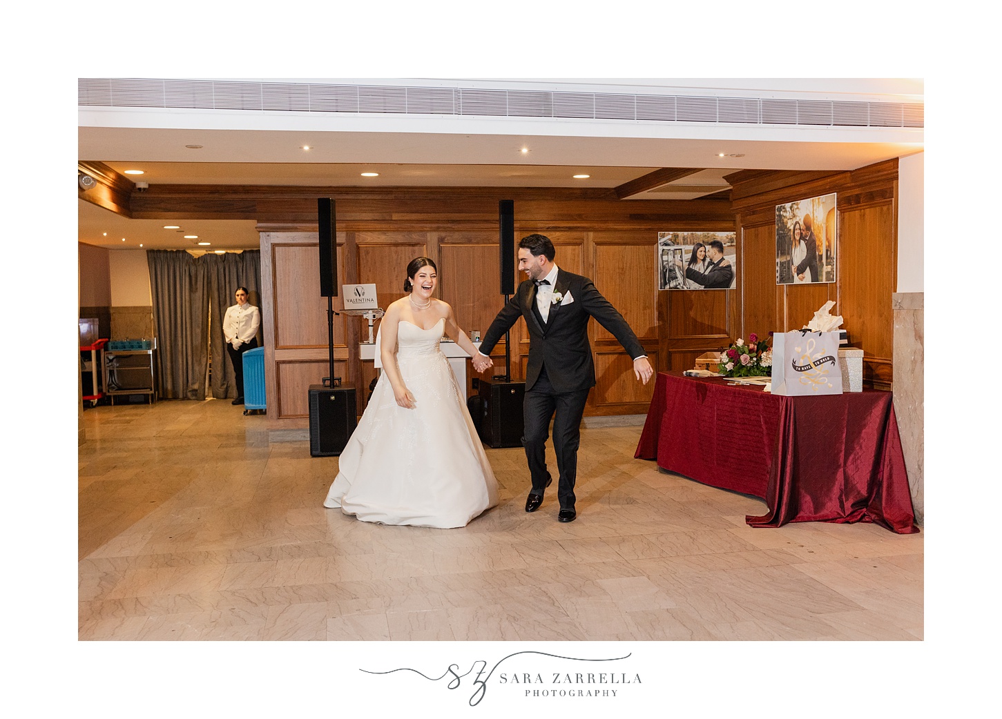 newlyweds enter wedding reception at the ballroom at the Providence G