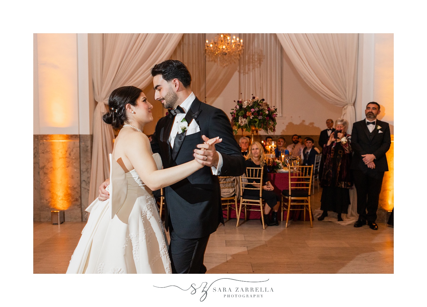 bride and groom dance together during reception at the ballroom at the Providence G