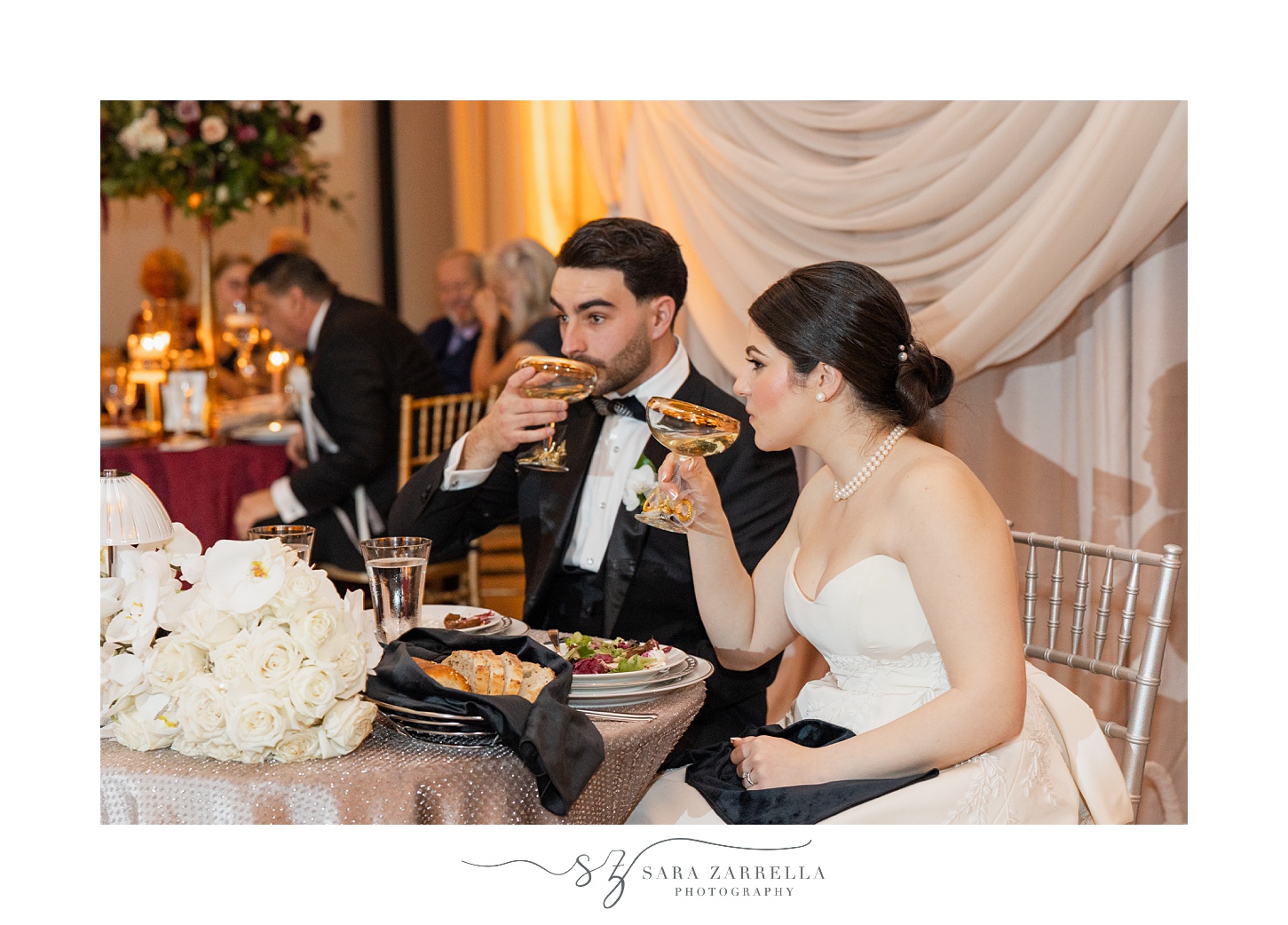 newlyweds drink martinis during reception at the ballroom at the Providence G