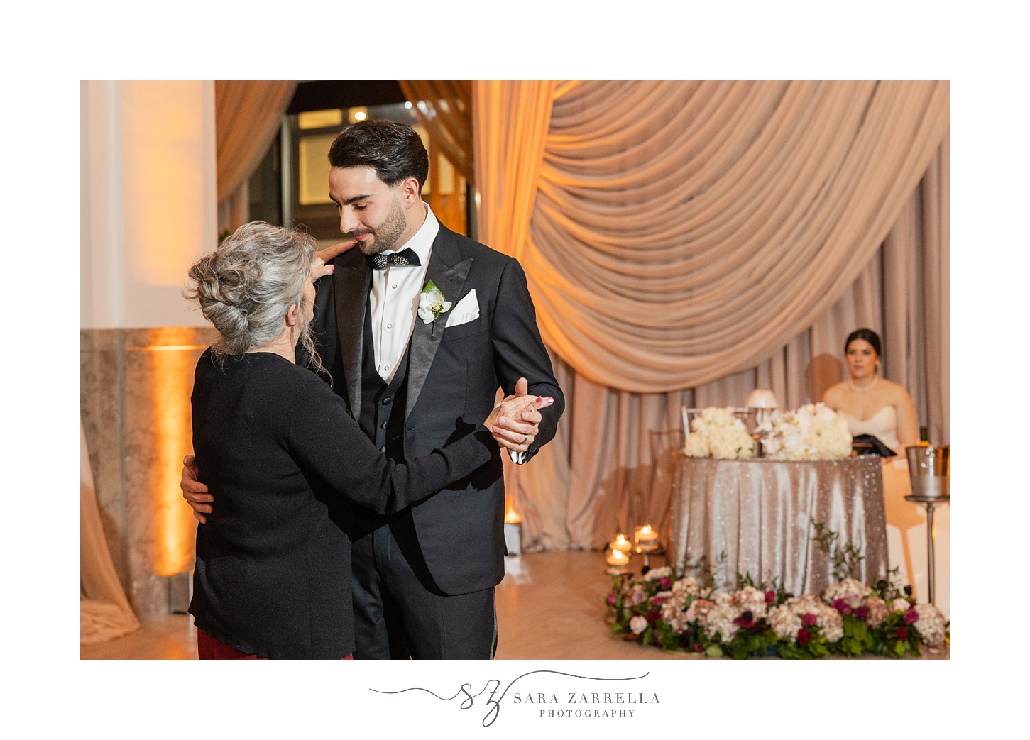 groom dances with mother in black dress during RI wedding reception