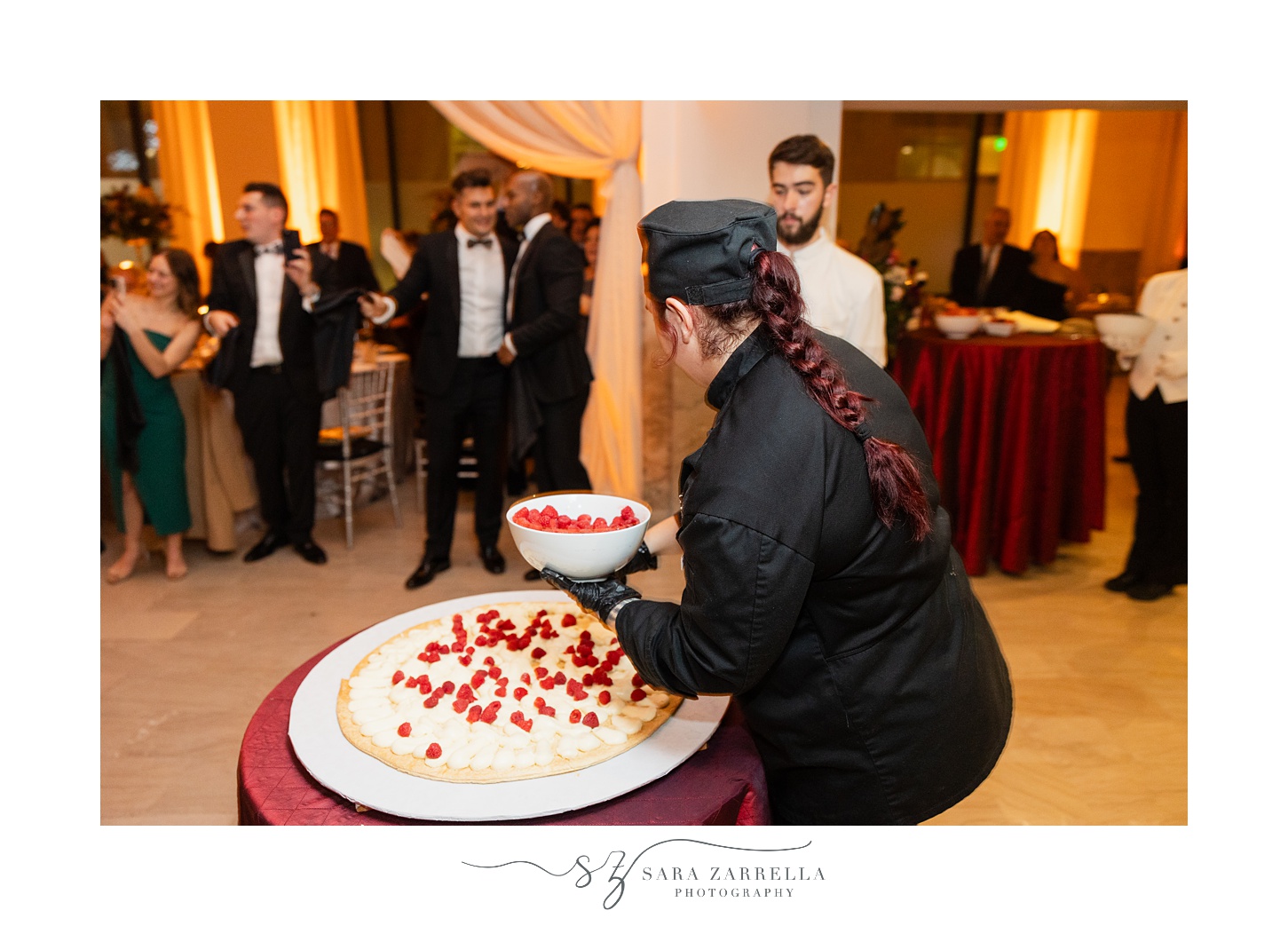 chef creates Italian wedding cake during wedding reception at the ballroom at the Providence G