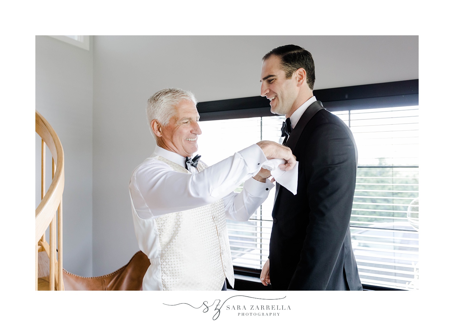 father helps groom with pocket square in Narragansett RI hotel