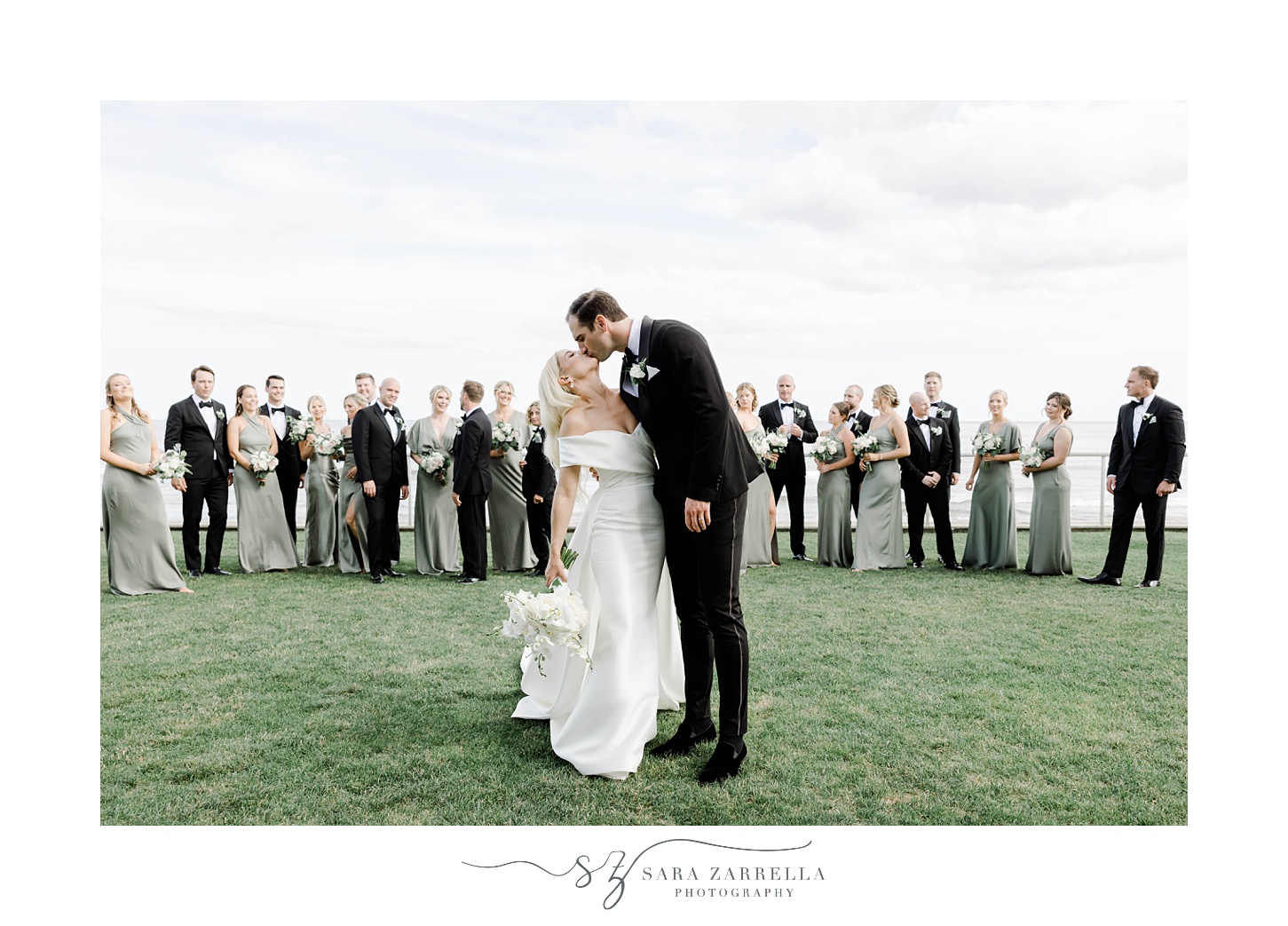 bride and groom kiss on lawn at the Dunes Club