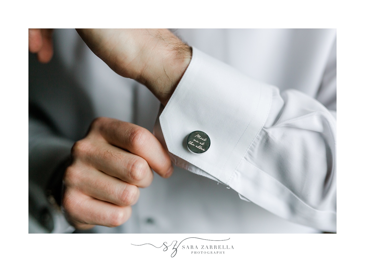 groom adjusts custom cufflinks during prep for New Year's Eve wedding