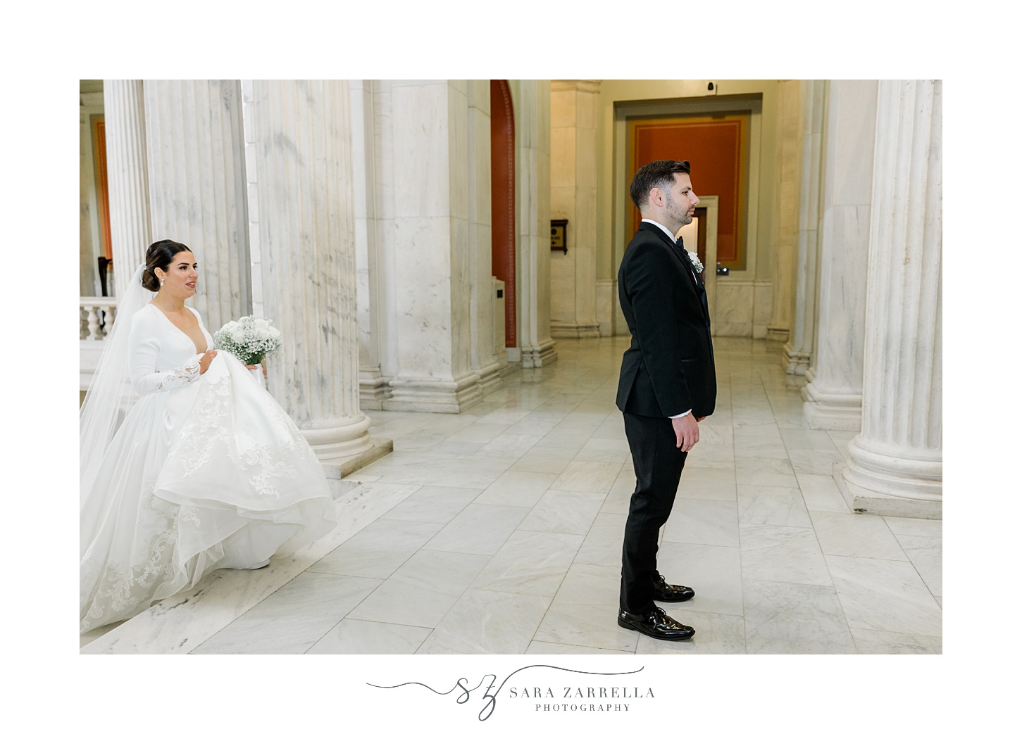bride walks up steps to meet groom for first look inside the Rhode Island State House