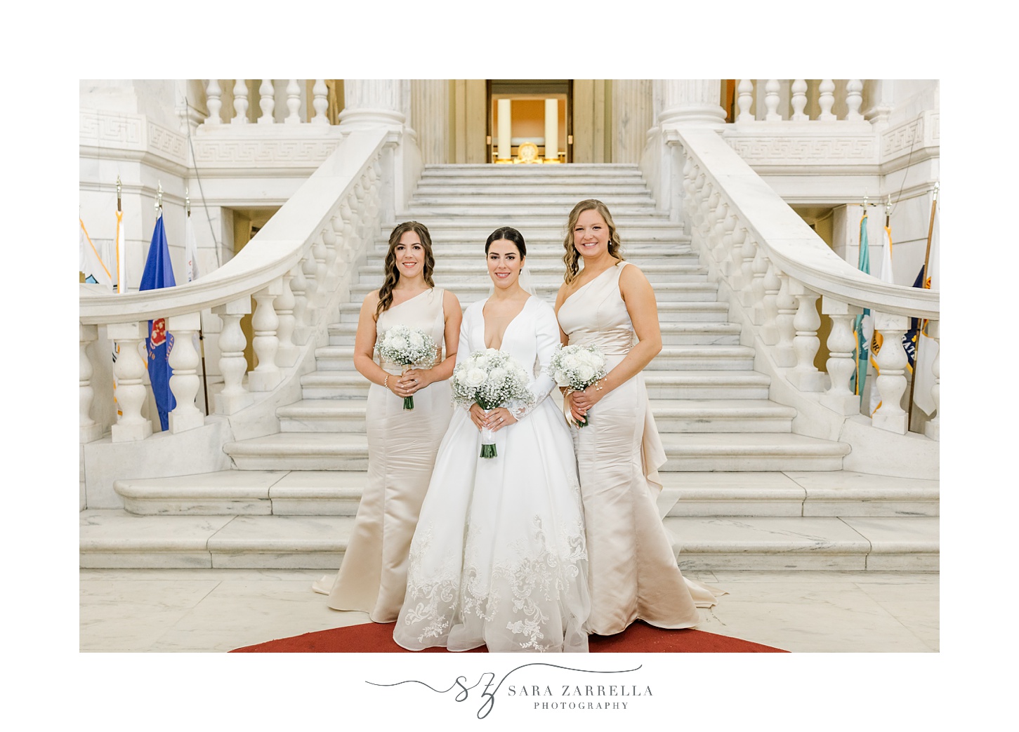 bride poses with bridesmaids in ivory gowns inside the Rhode Island State House in Providence RI