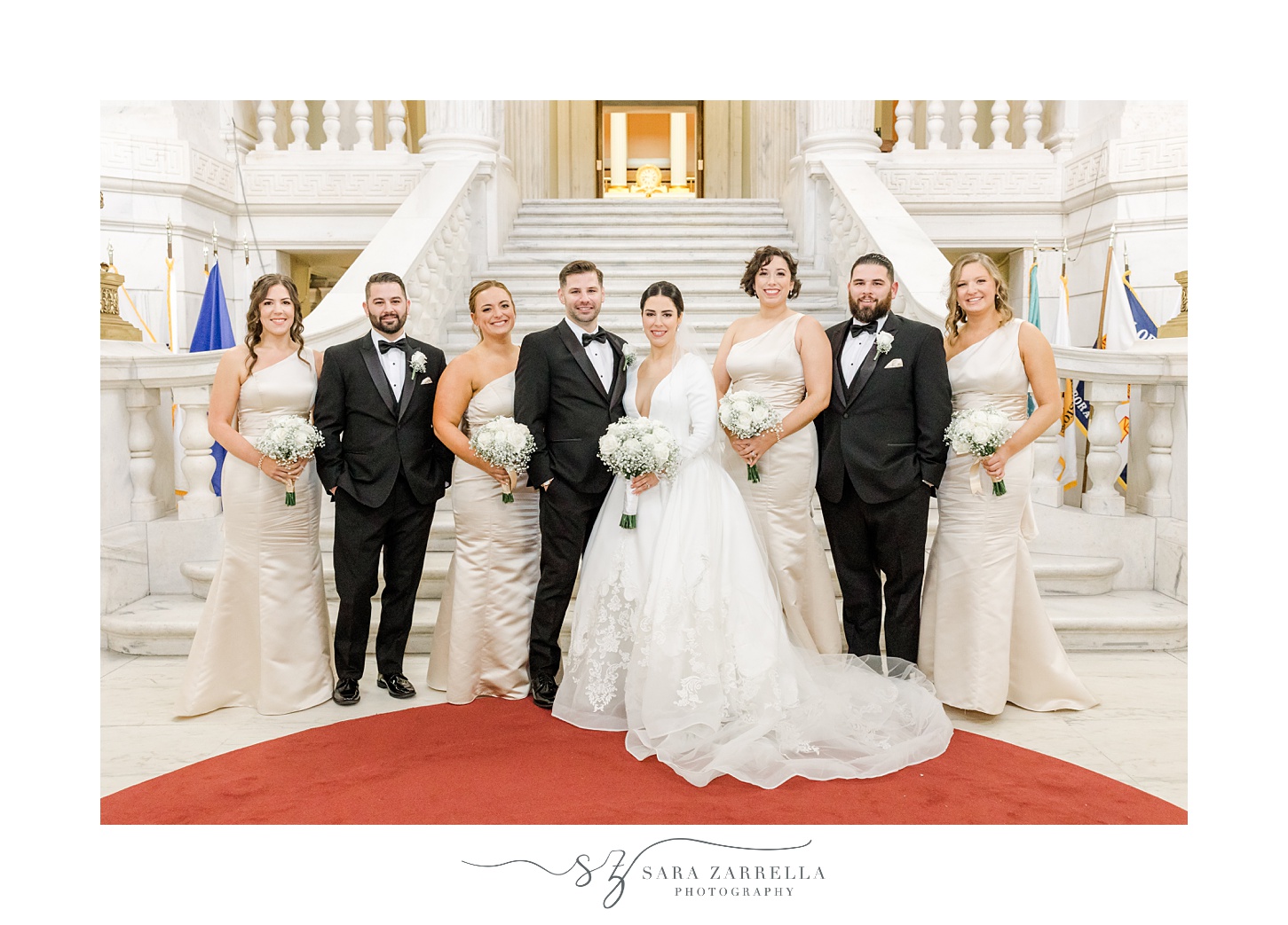 bride stands with bridal party in a line inside the Rhode Island State House in Providence RI
