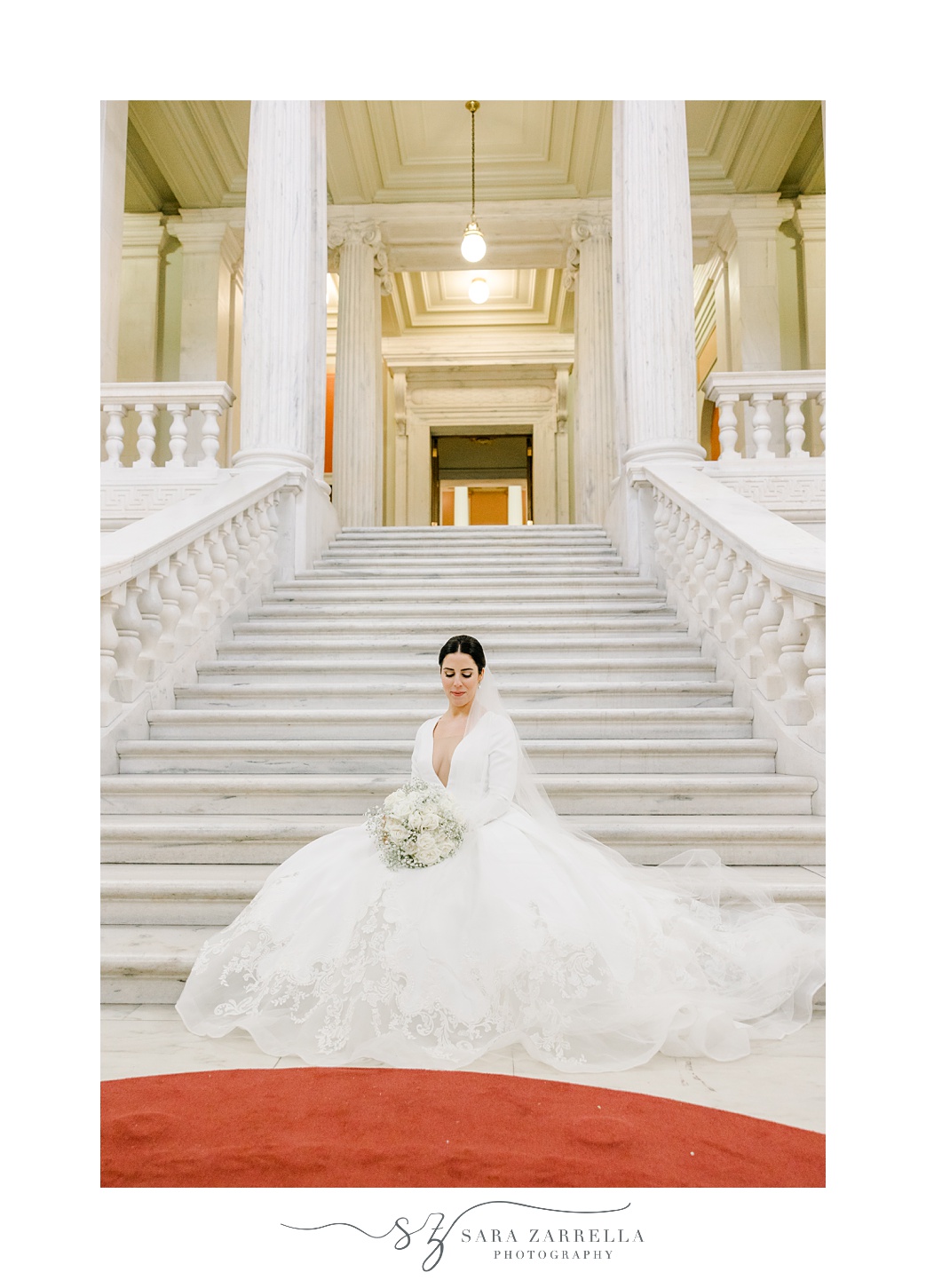 bride sits on steps inside the Rhode Island State House in Providence RI