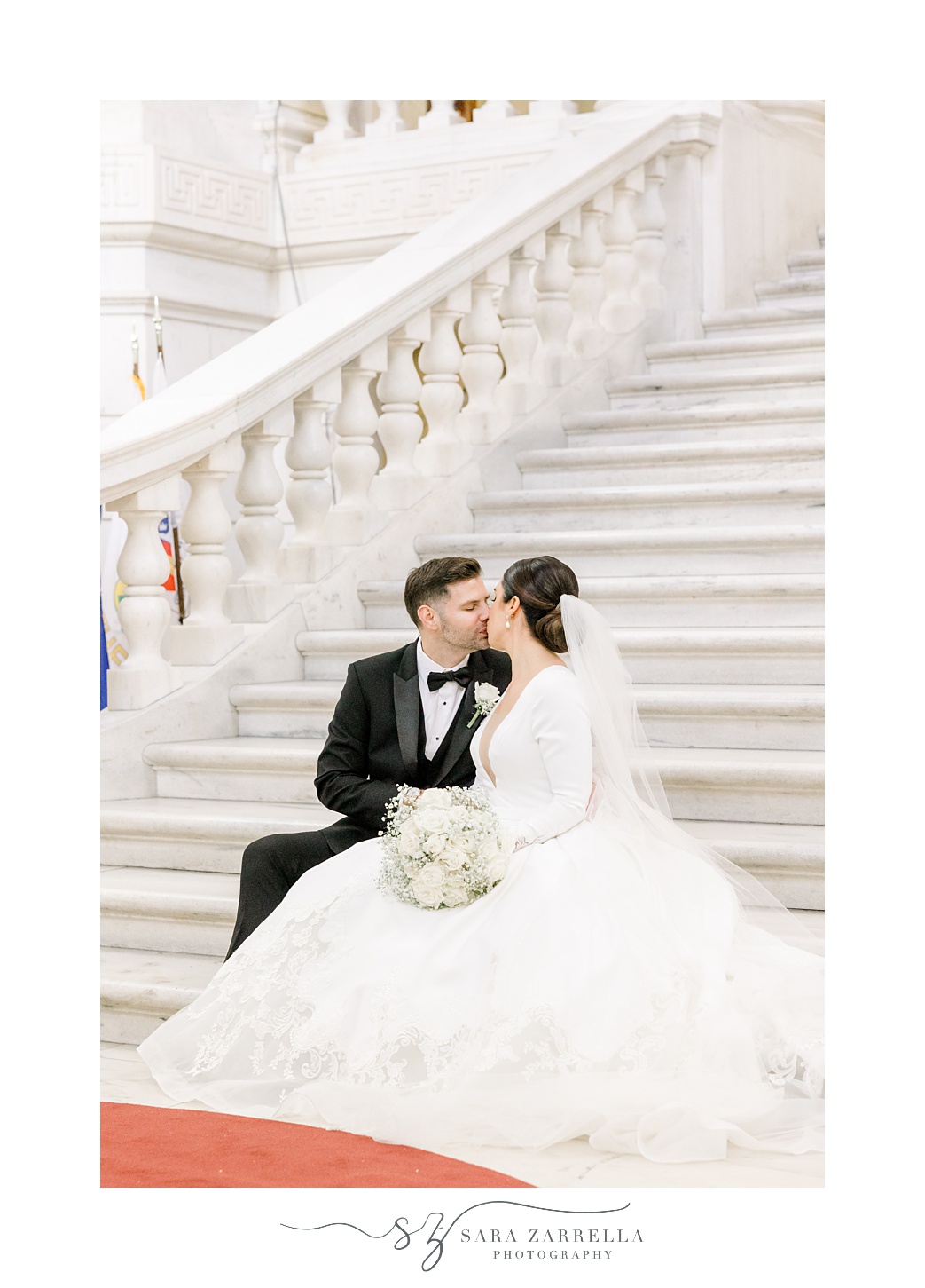 newlyweds kiss on staircase inside the Rhode Island State House in Providence RI