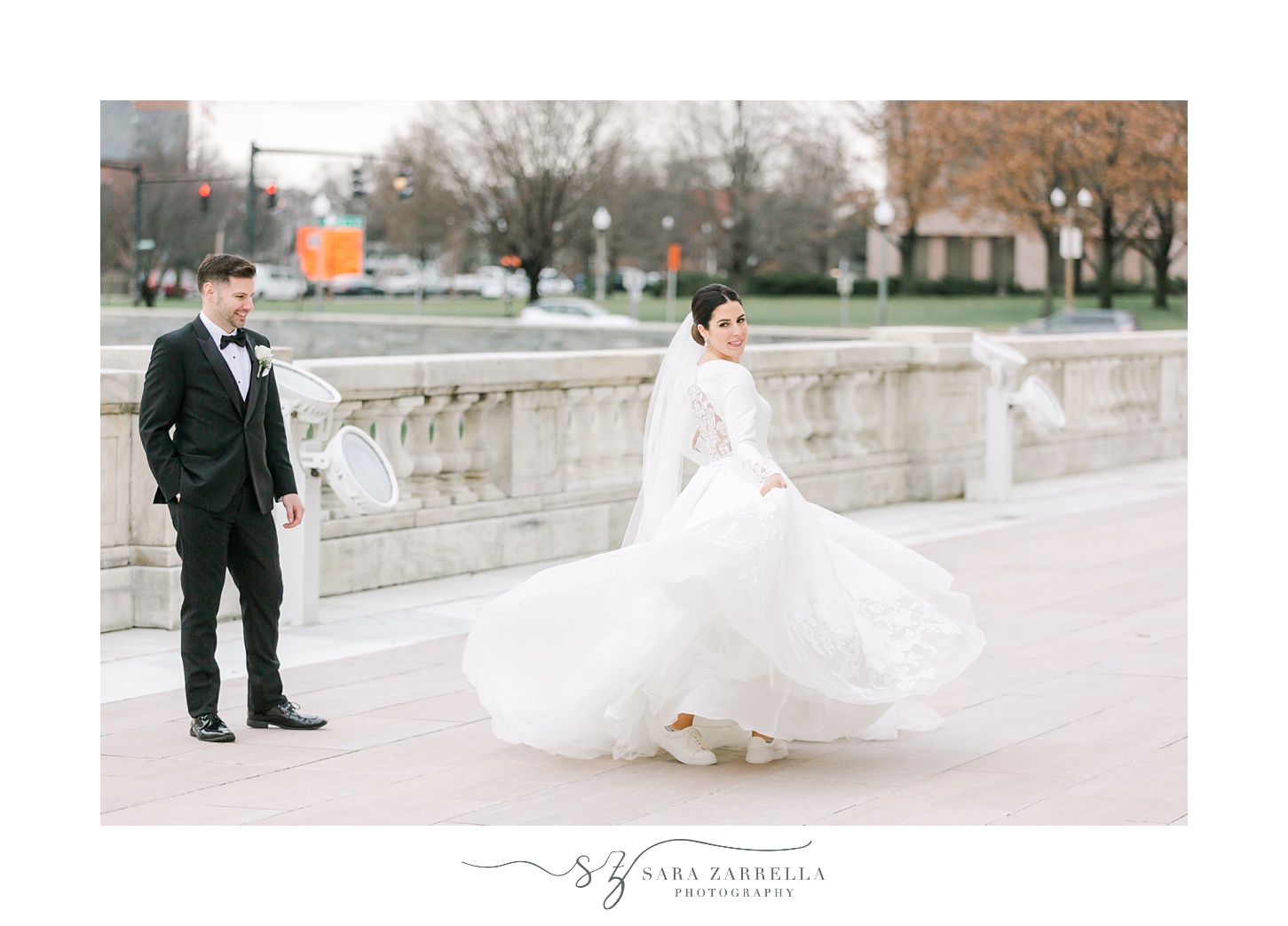 groom twirls bride outside the Rhode Island State House in Providence RI
