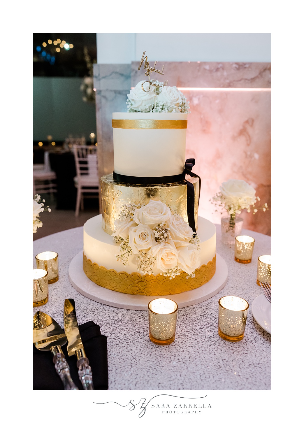 tiered wedding cake with gold and black details for New Year's Eve wedding reception at the Providence G