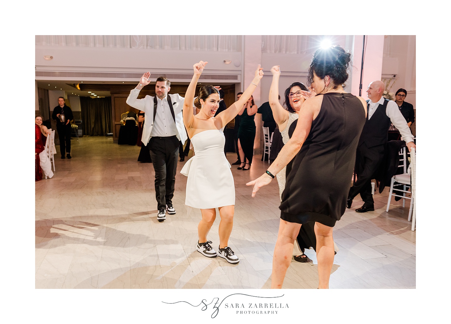 bride and groom dance in party outfits during Providence RI wedding reception