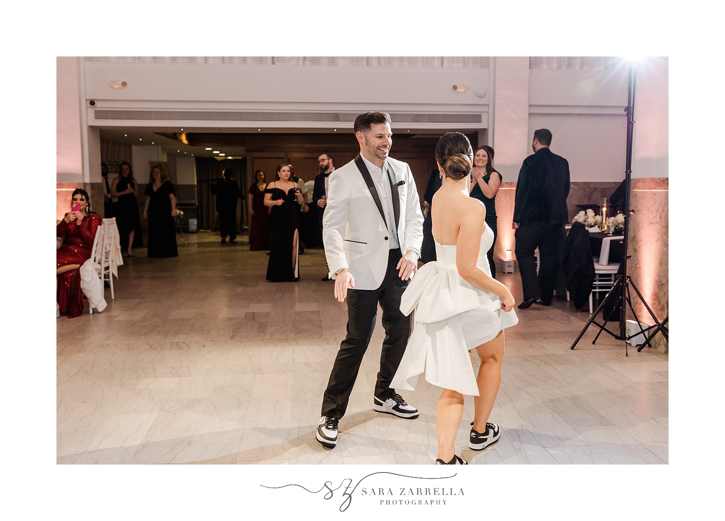 bride and groom dance in party outfits during Providence RI wedding reception