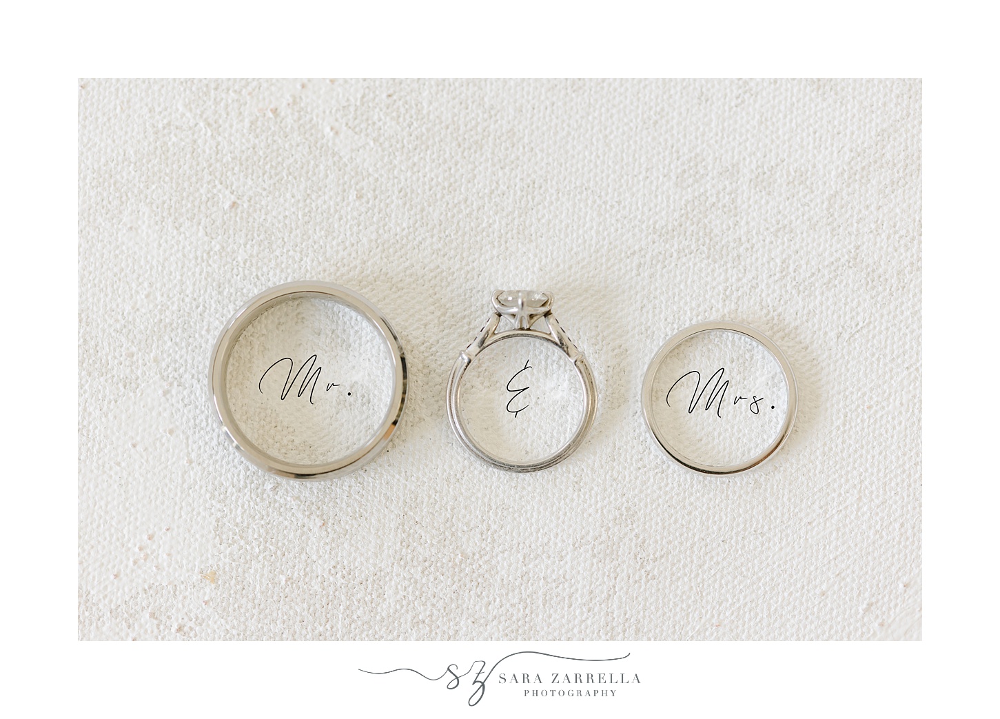 diamond and silver wedding bands over top Mrs and Mr calligraphy 