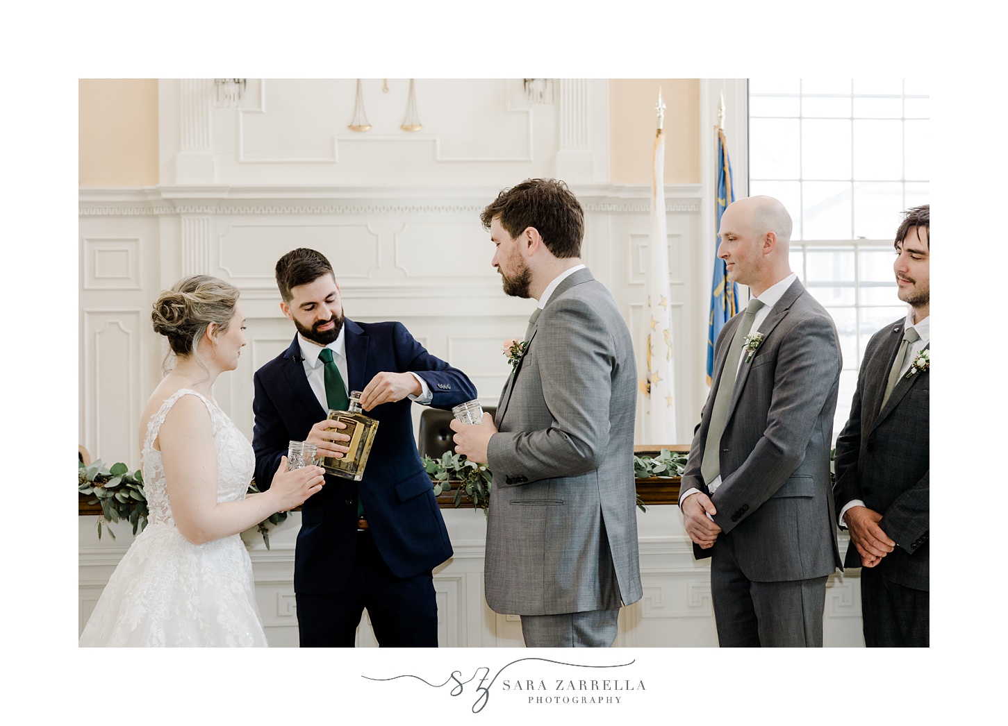 bride and groom drink rum together during ceremony at East Greenwich Town Hall