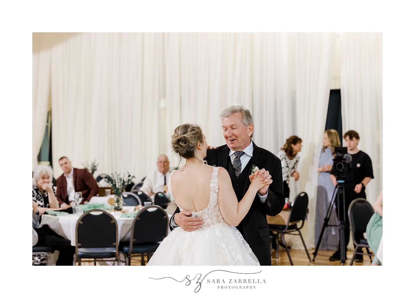 bride dances with dad during wedding reception