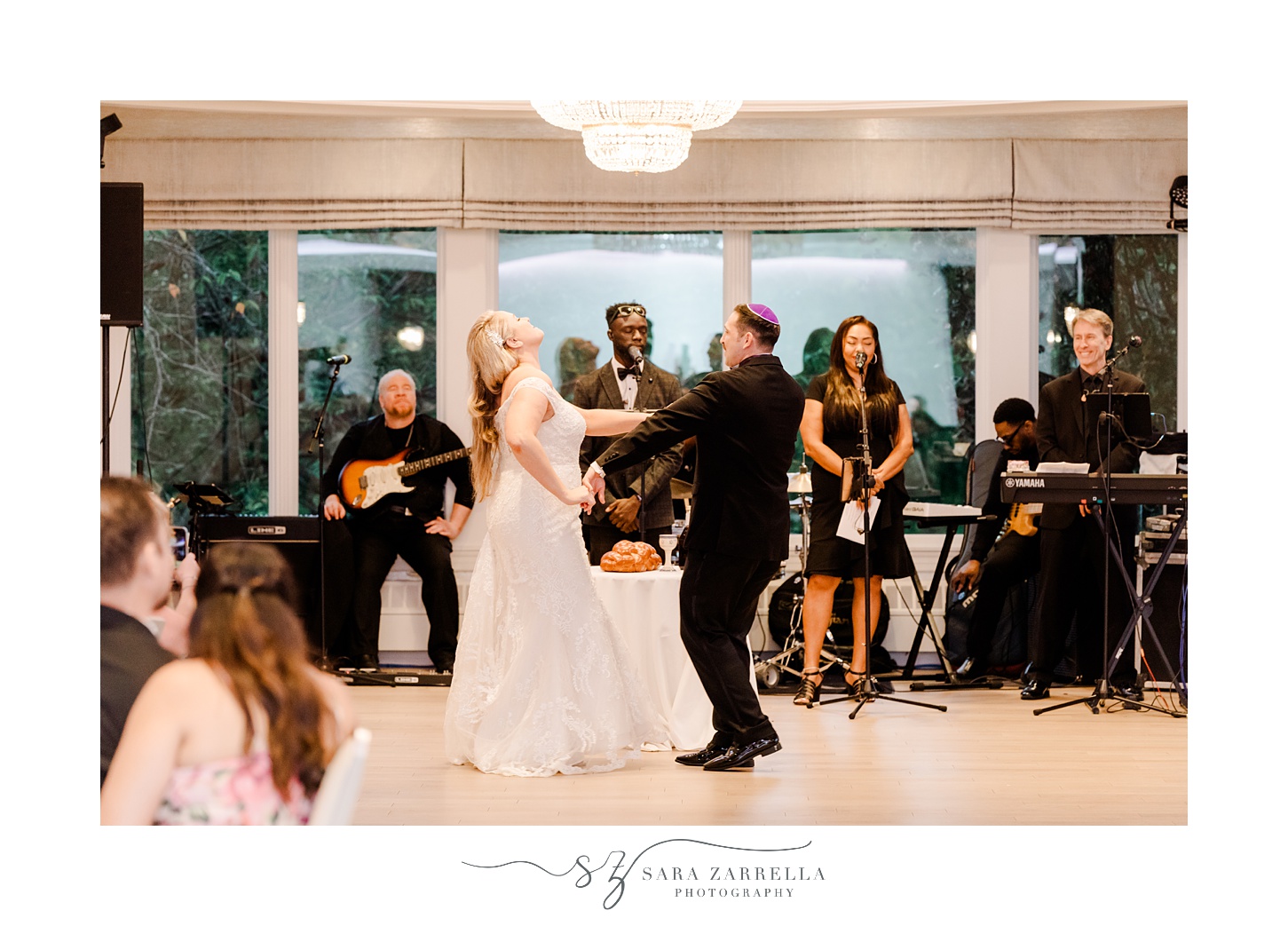 bride and groom dance in ballroom at Quidnessett Country Club