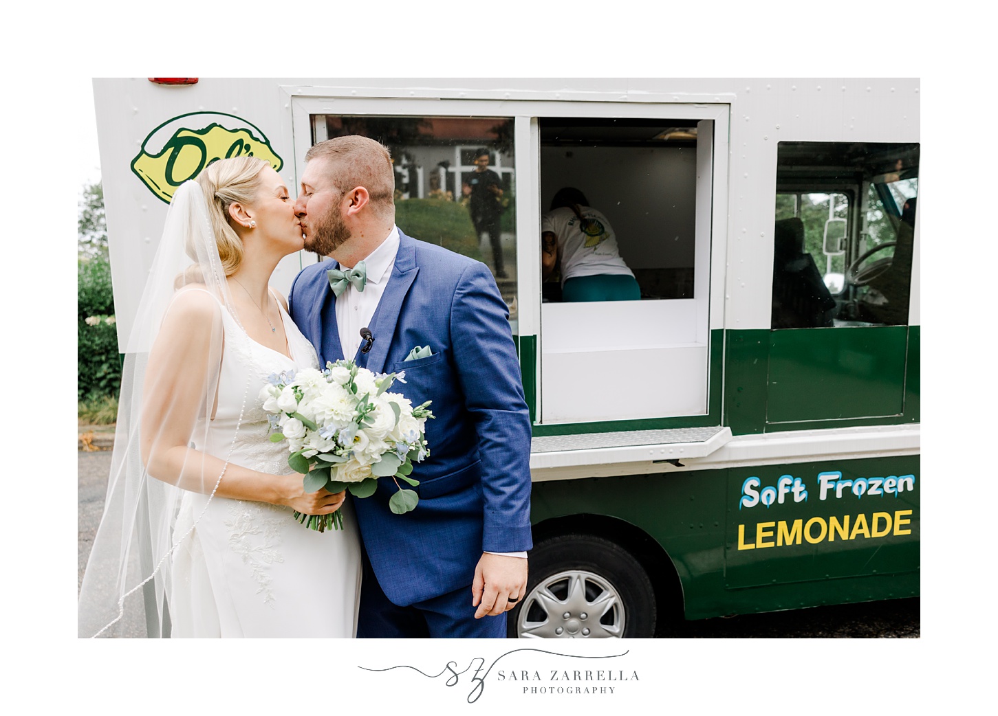 bride and groom kiss by Del's Lemonade truck in Narragansett RI