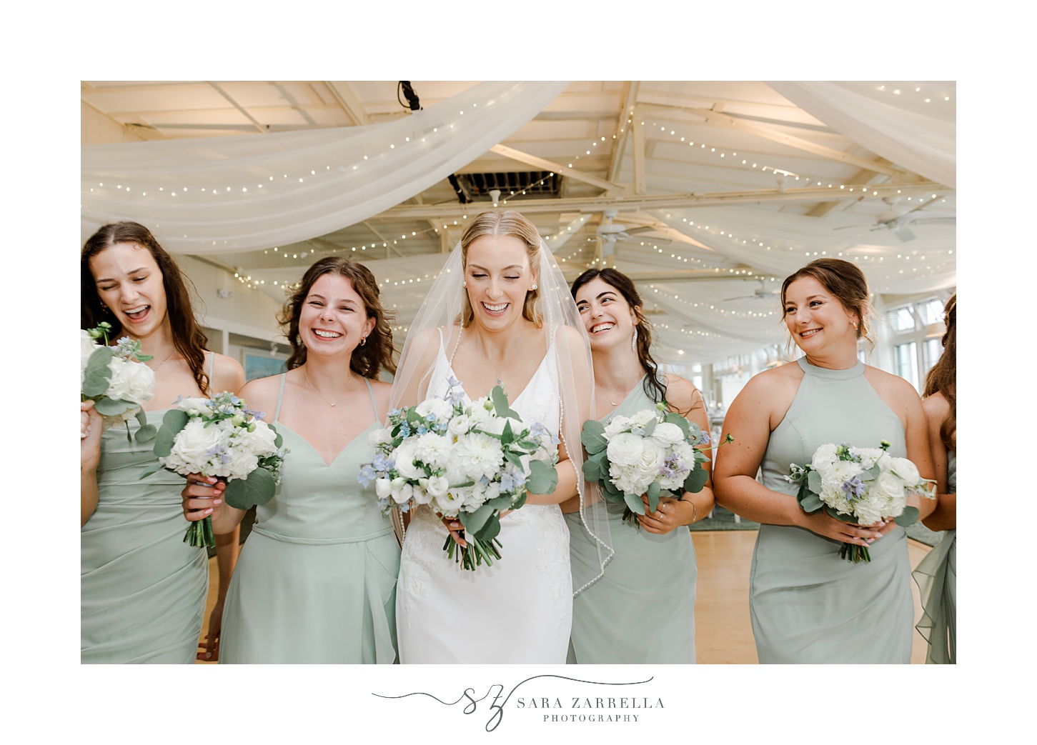 bride walks with bridesmaids in sage green in reception space at the Dunes Club