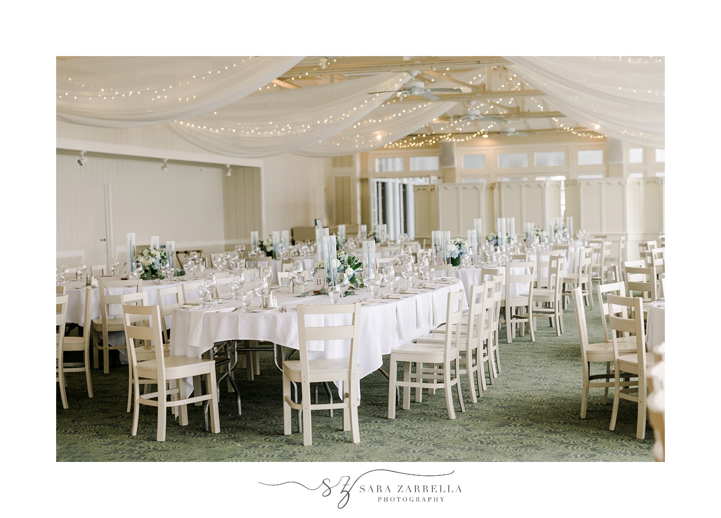 wedding reception with blue and white flowers on the table at the Dunes Club