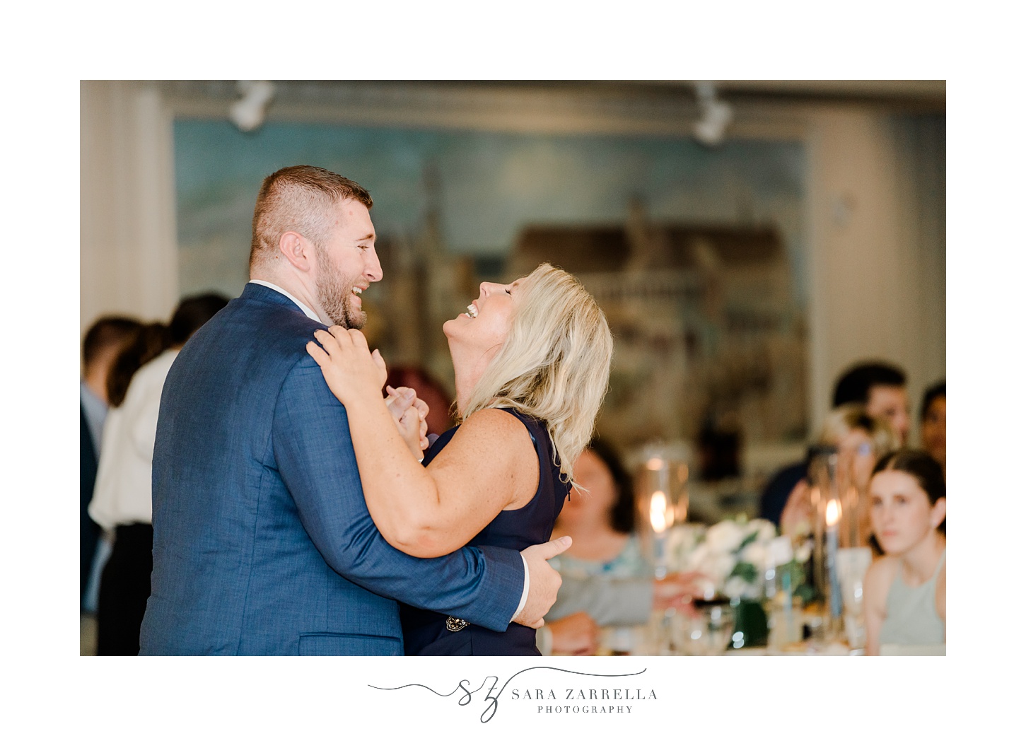 groom laughs with mom during wedding reception at the Dunes Club