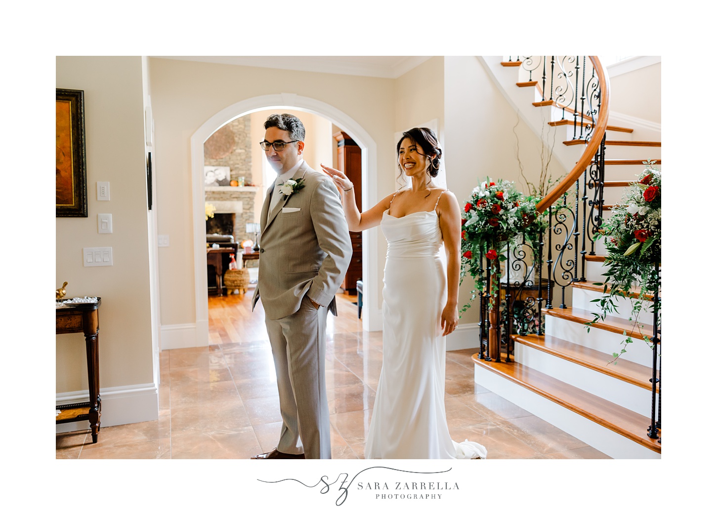 bride taps groom's shoulder during first look in Rhode Island home