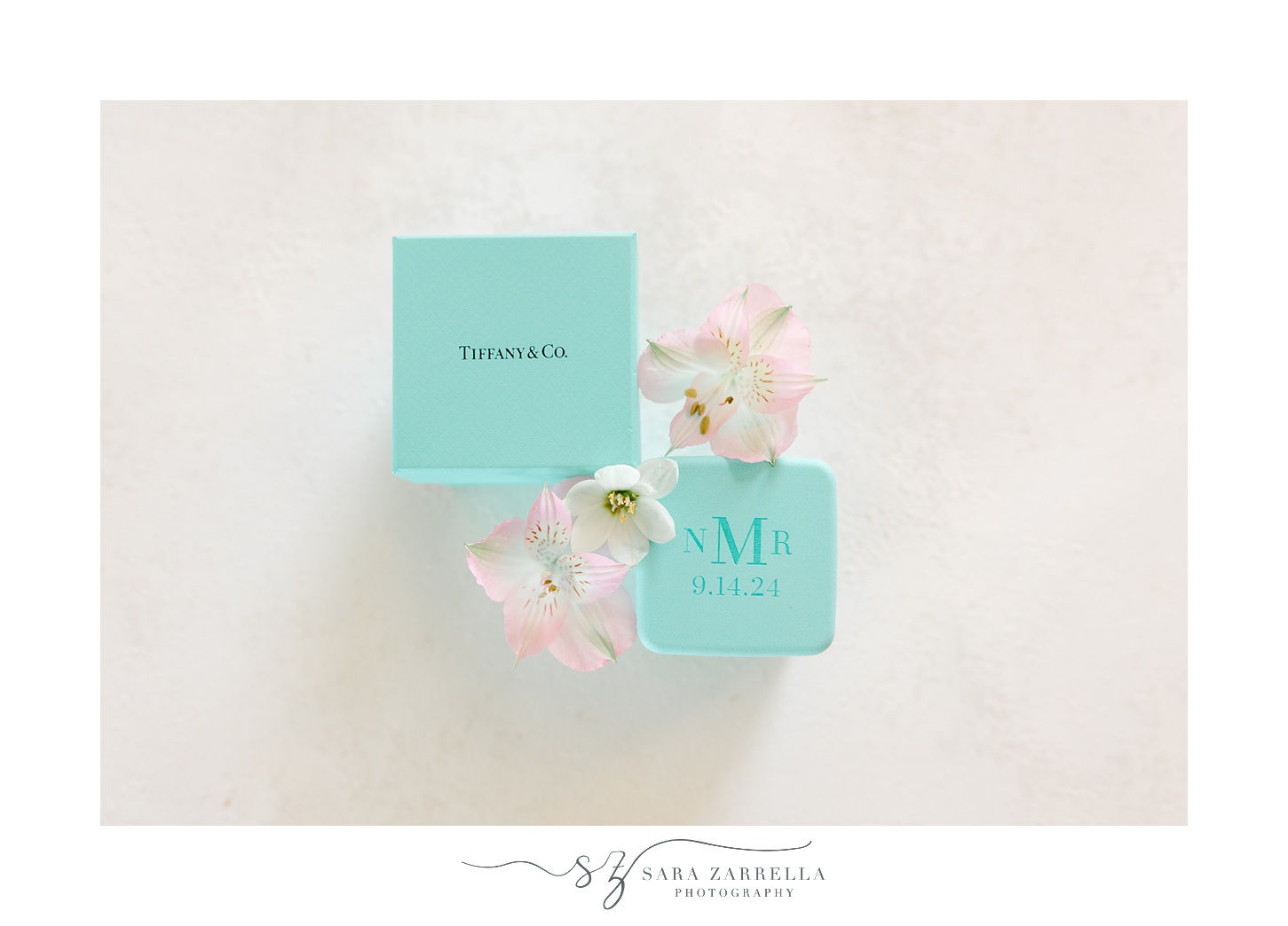 pink flowers with two blue Tiffany & Co boxes