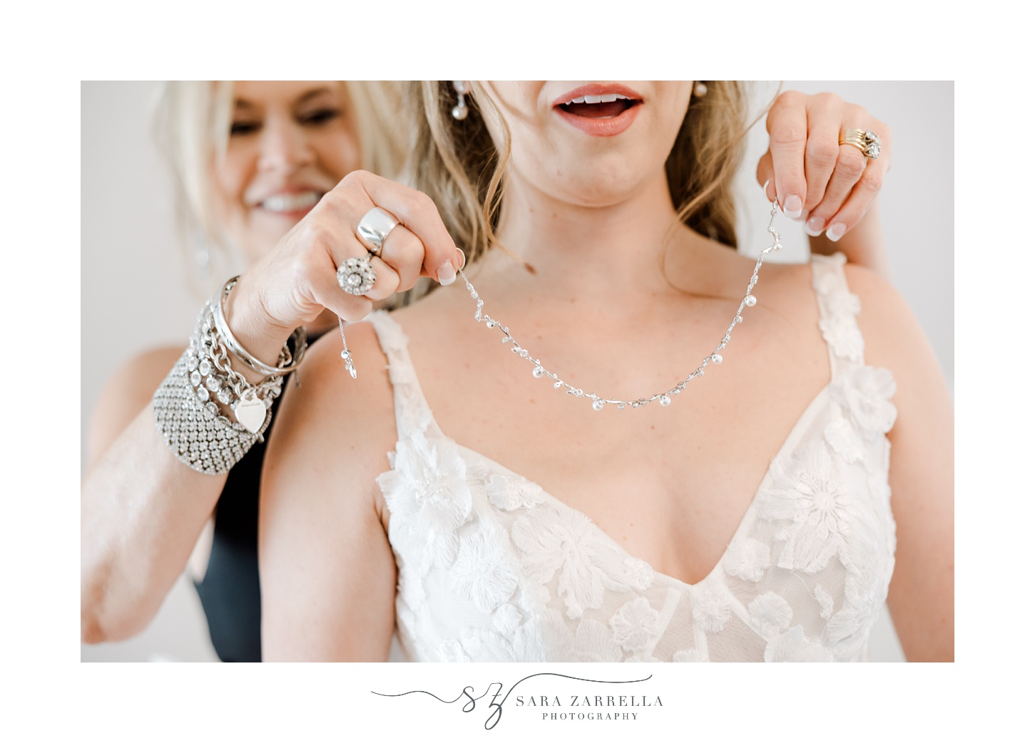 mother helps bride with necklace during prep for wedding at Shepard's Run