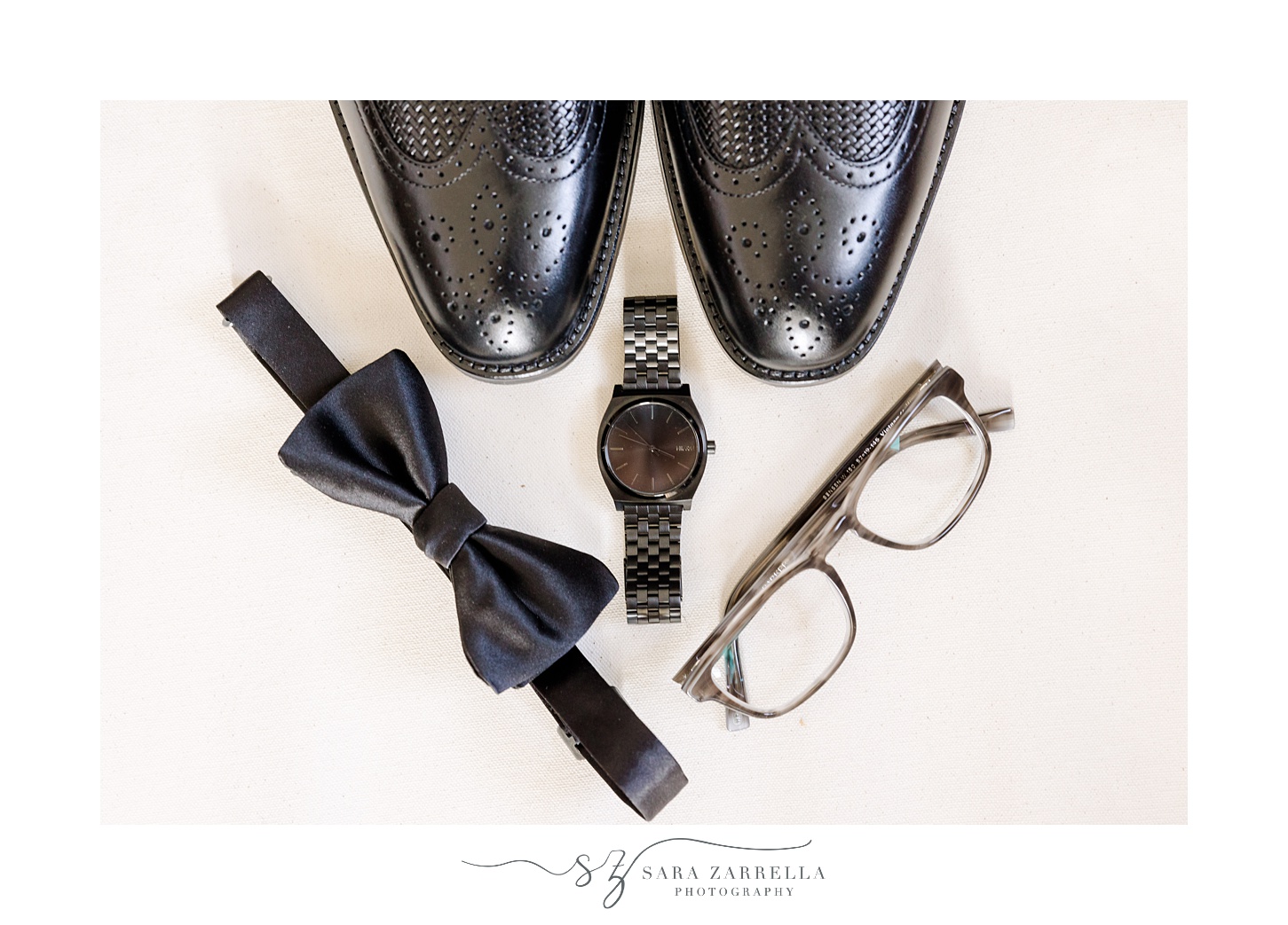 groom's black shoes, bow tie and glasses for RI wedding day