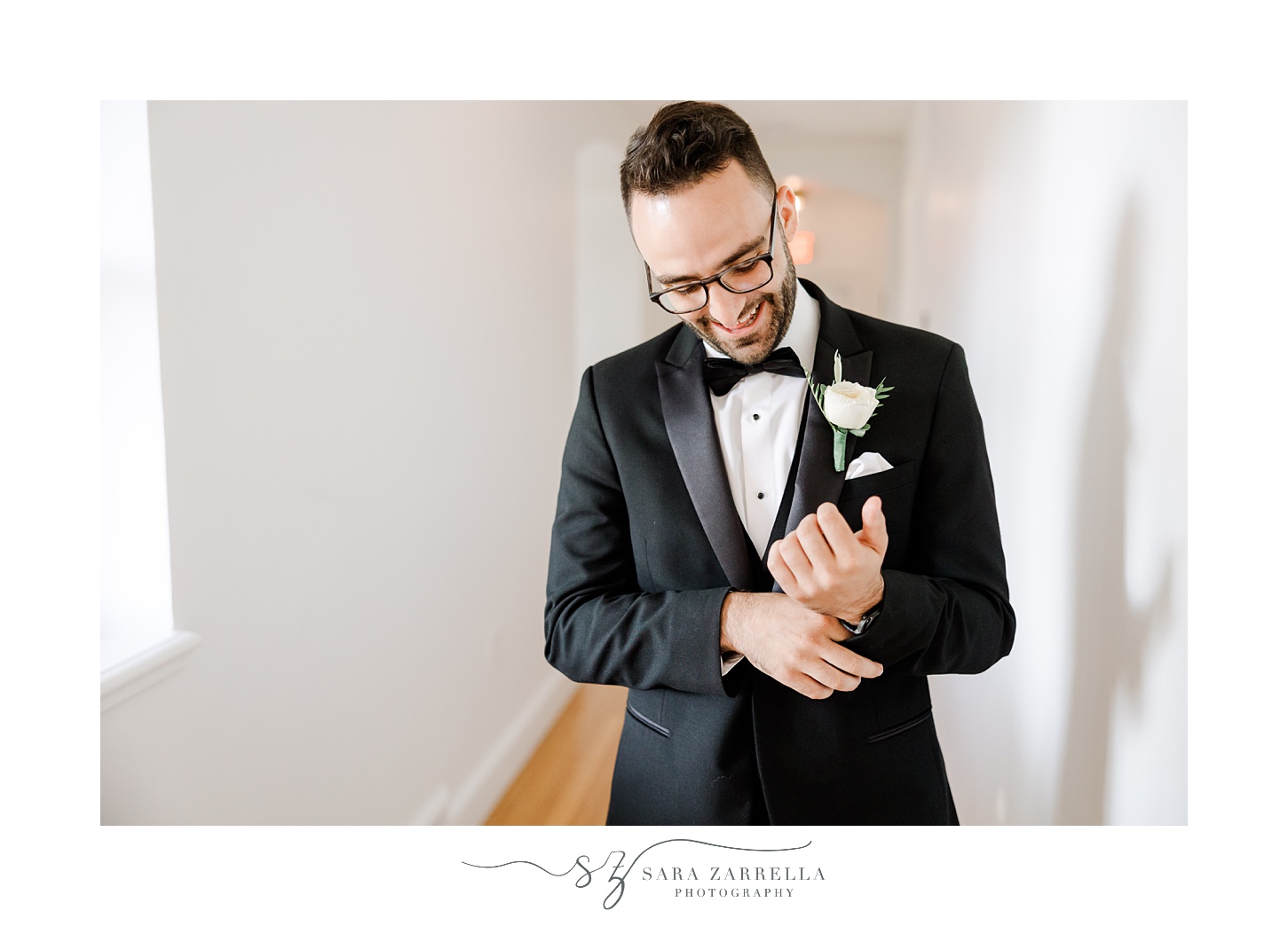 groom adjusts suit jacket sleeves during prep at Shepard's Run