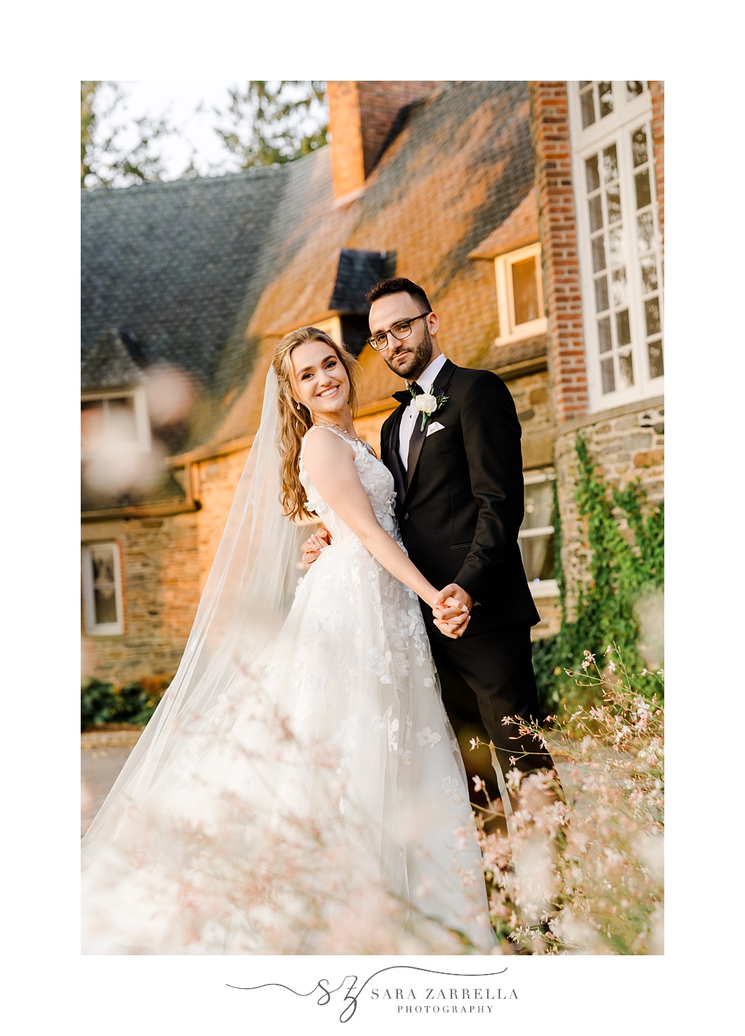 bride and groom hold hands in front of windows at Shepard's Run