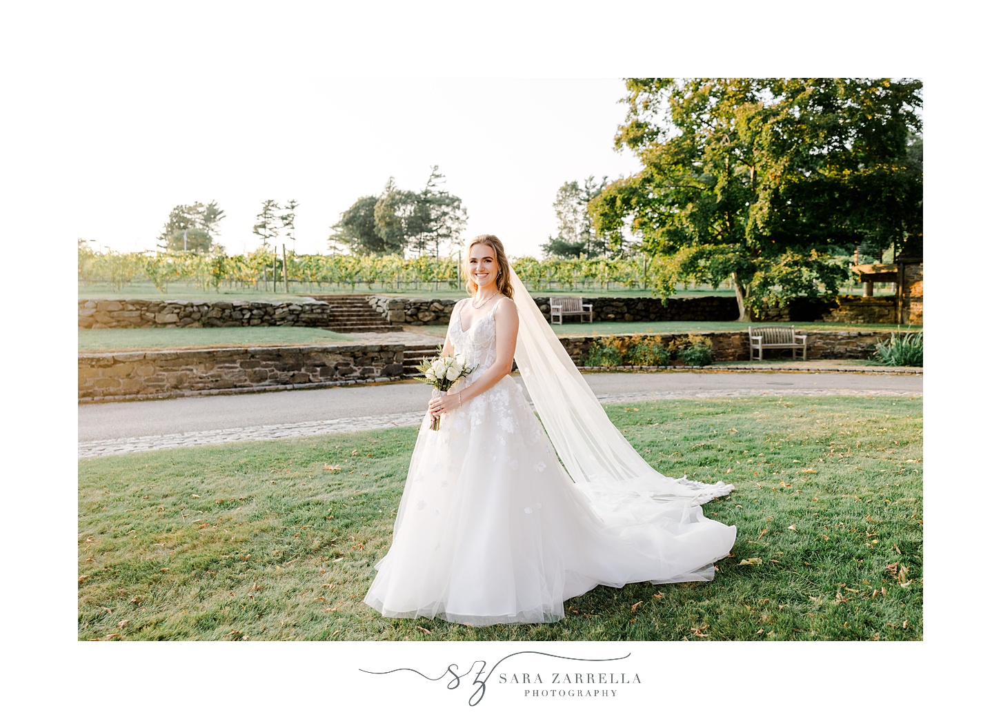 bride holds bouquet of white flowers on lawn at Shepard's Run